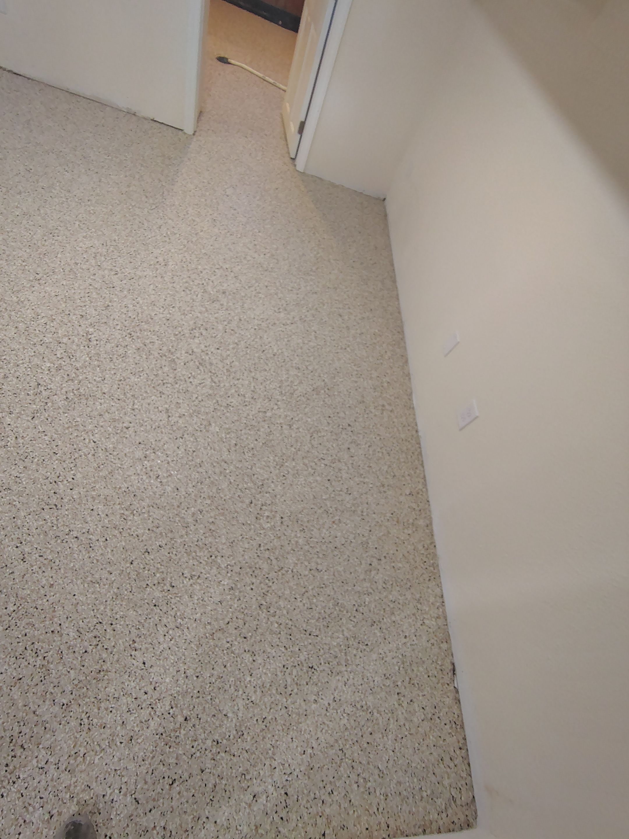 Comprehensive Basement Concrete Floor Coating and Crack Repair in Sioux Falls by Select Painting, Coatings & Garage Cabinets