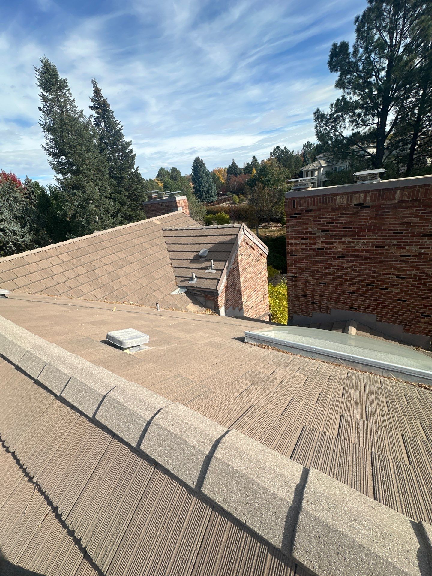 Unified Stone Coated Roof & Stucco Remodle by Blue Peaks Roofing LLC