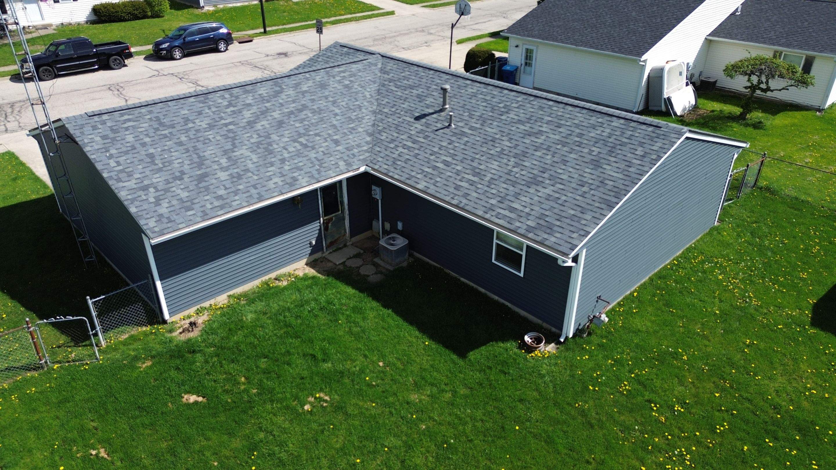 Storm Damage Residential Roof and Siding Installation by WIW Enterprises Inc