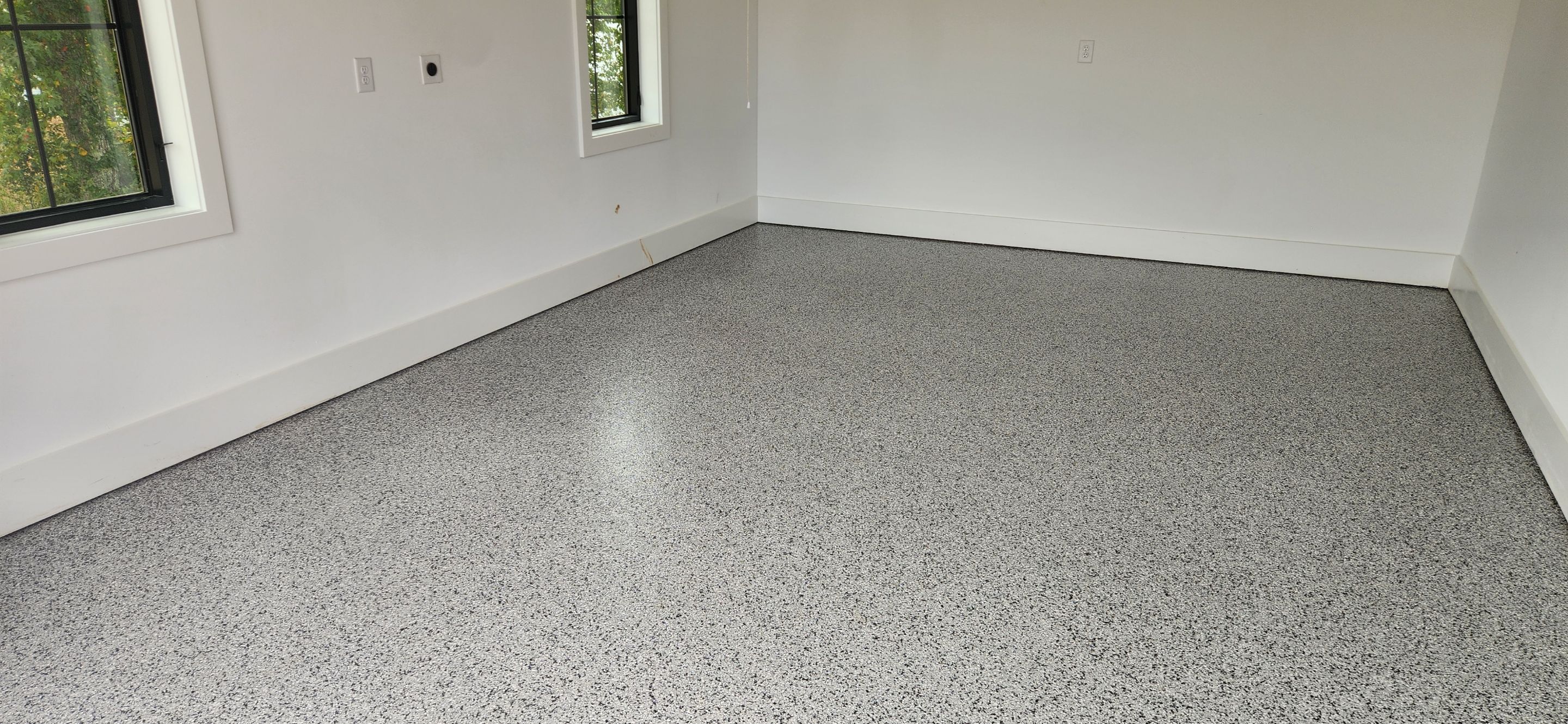 Garage Transformation Using Houndstooth by Elite Floor Solutions