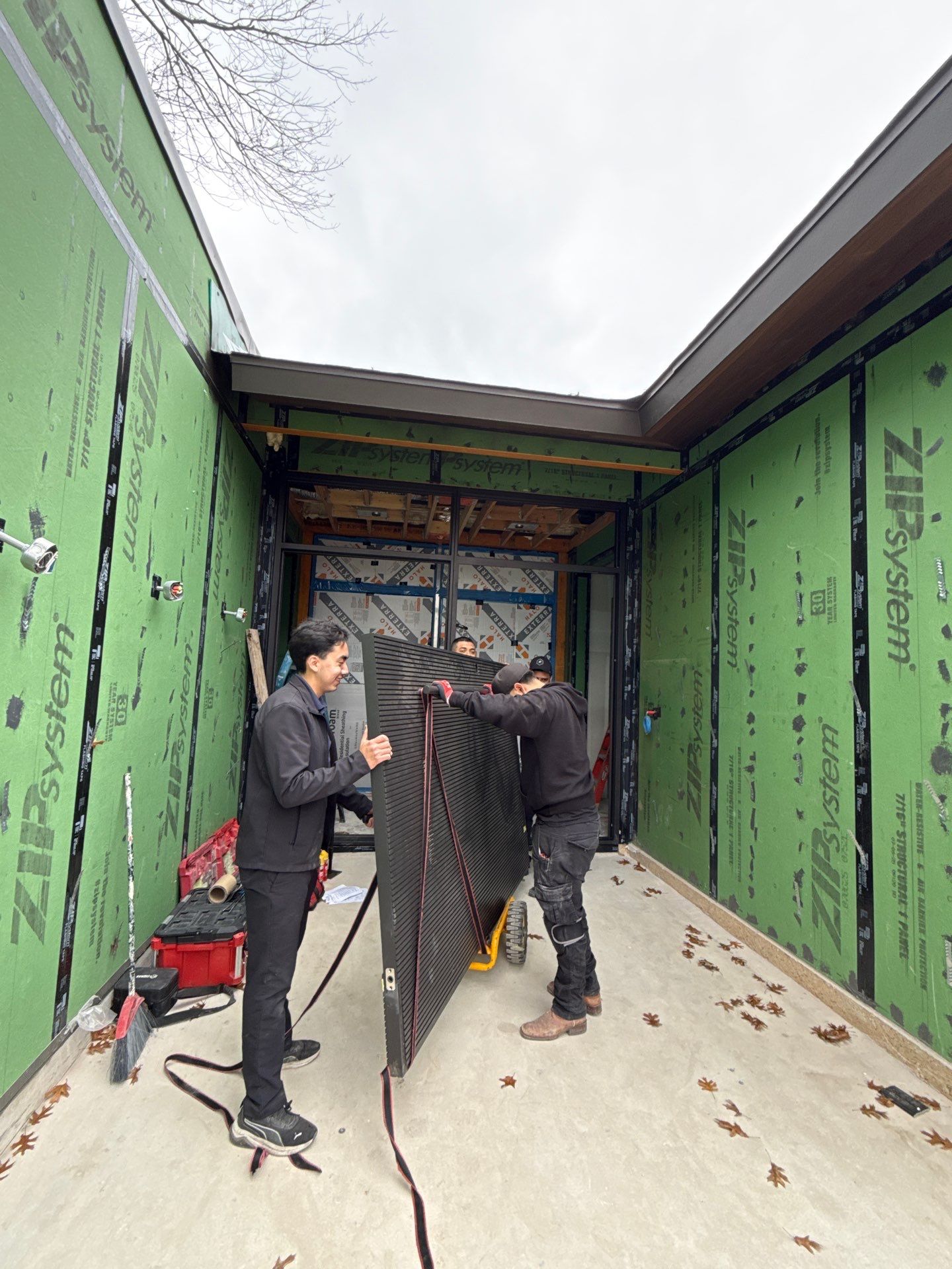 Custom Steel Oporto Pivot Door Installation for Dallas New Construction by Solara Custom Living
