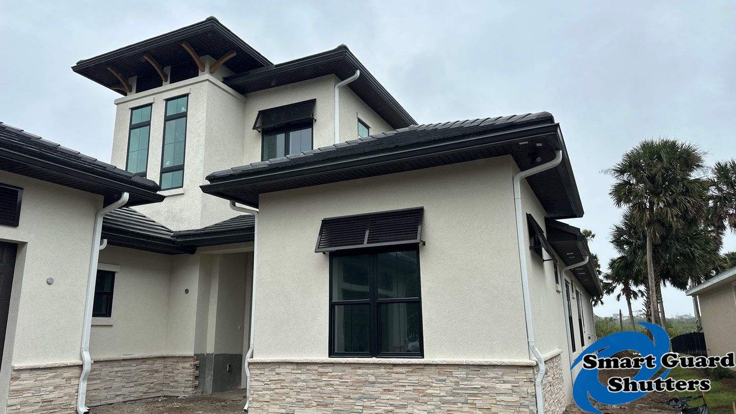 Decorative Bahama Shutters in Grey Brown by Smart Guard Shutters