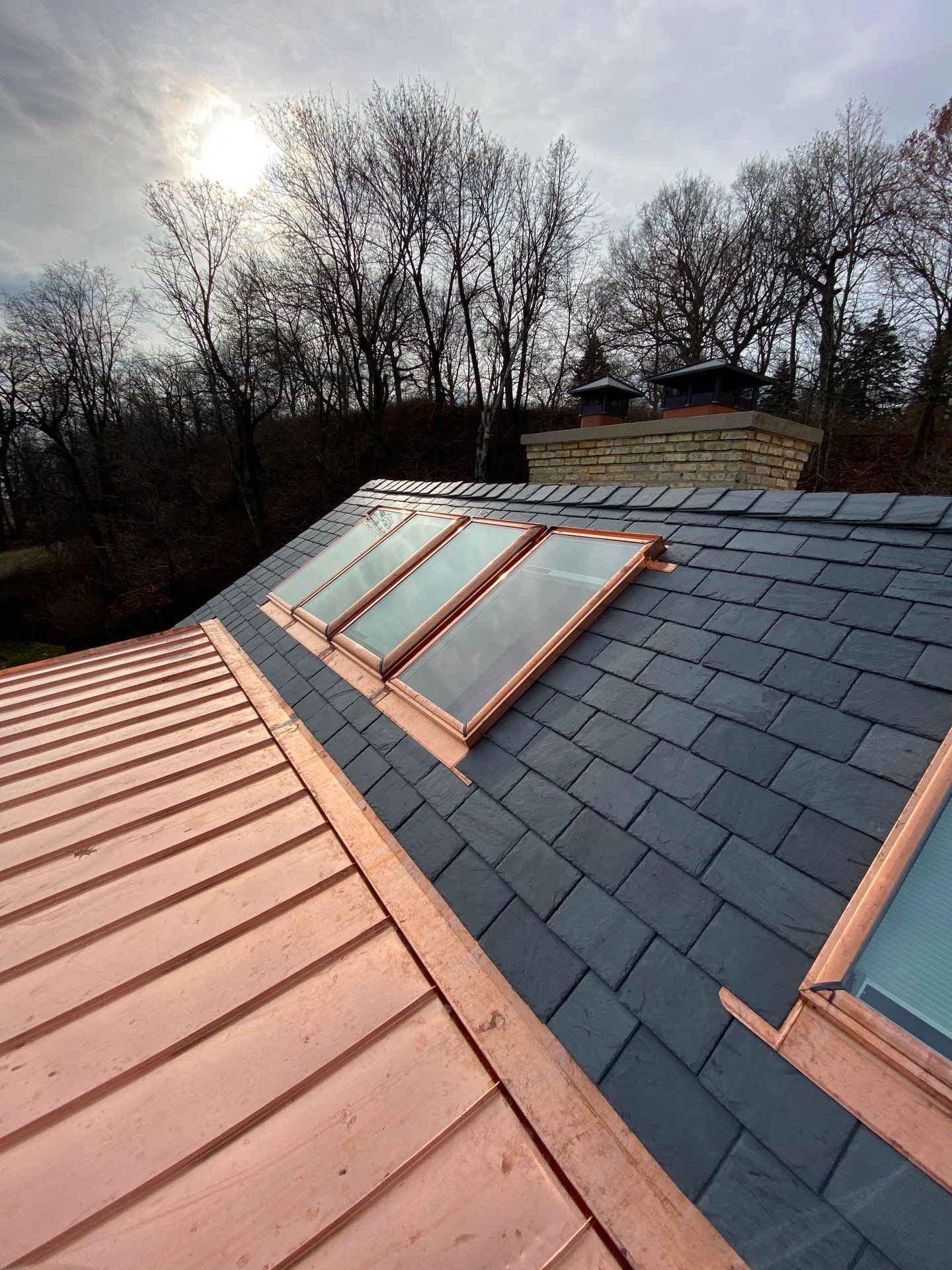 Slate Roof Replacement and Half Round Copper Gutter Installation by Custom Installations