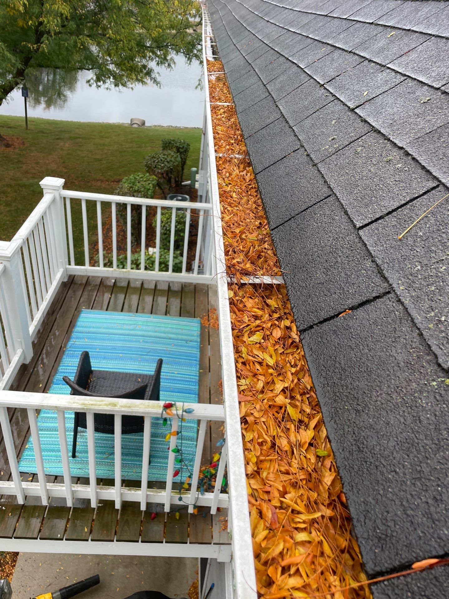 Commercial gutter cleaning Schaumburg & Hoffman Estates, IL before photo with filled gutters