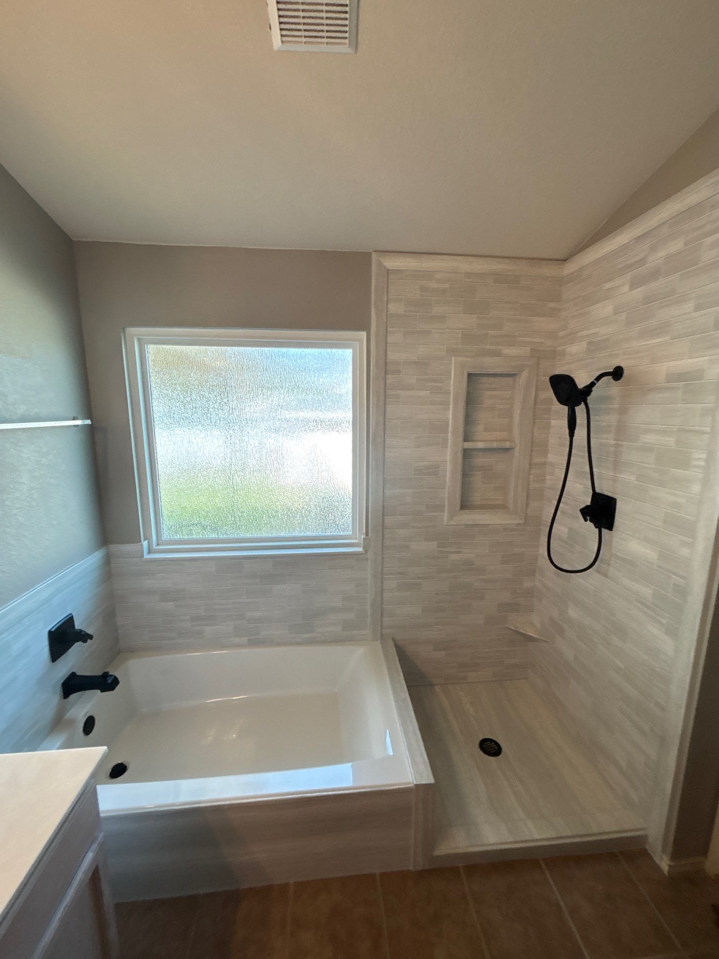 New walk in shower and tub in Kyle by Lane Lauritsen - The Hill Country, Texas
