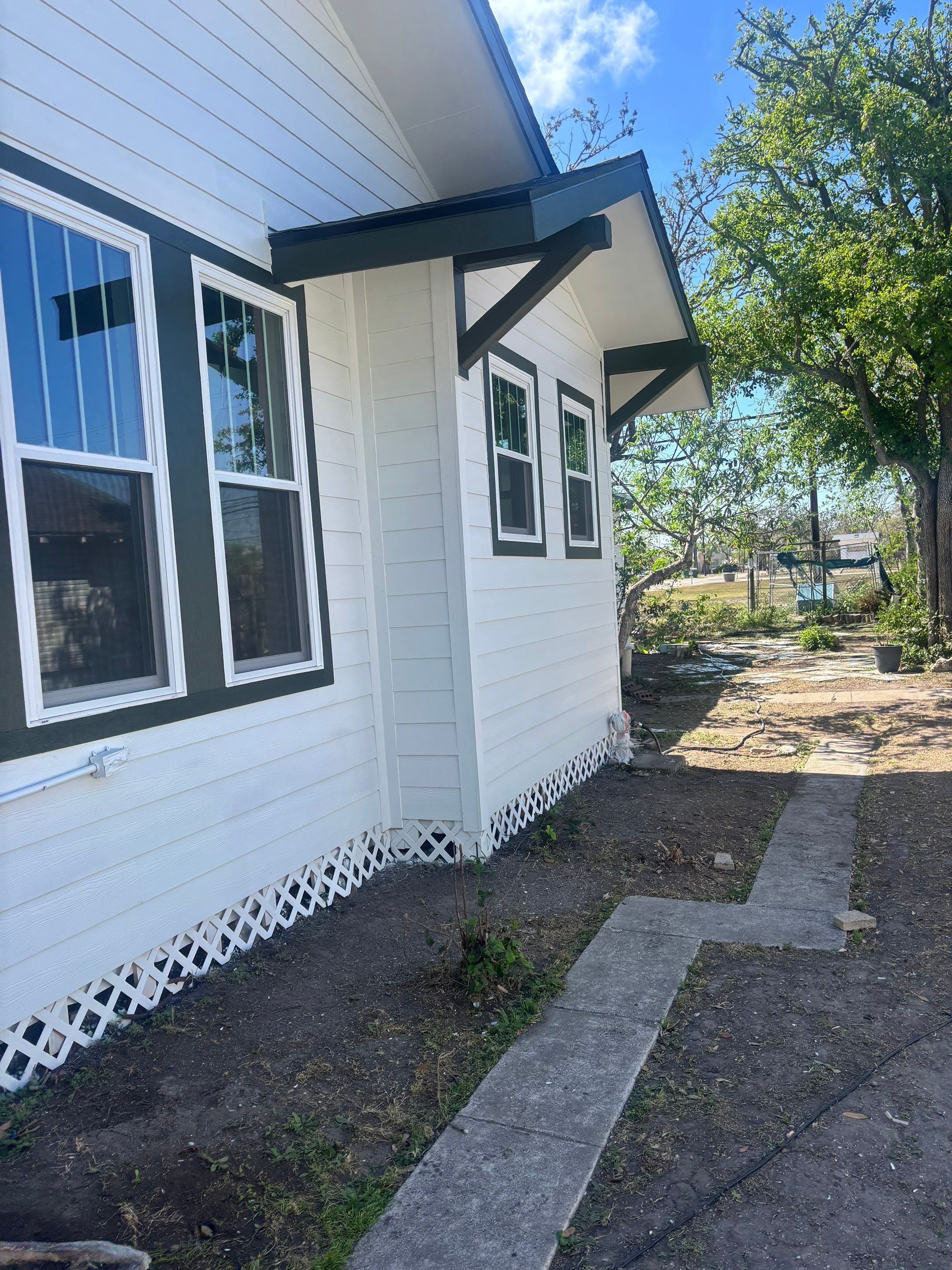 Mid-Century Bungalow by Bayfront Roofing and Construction