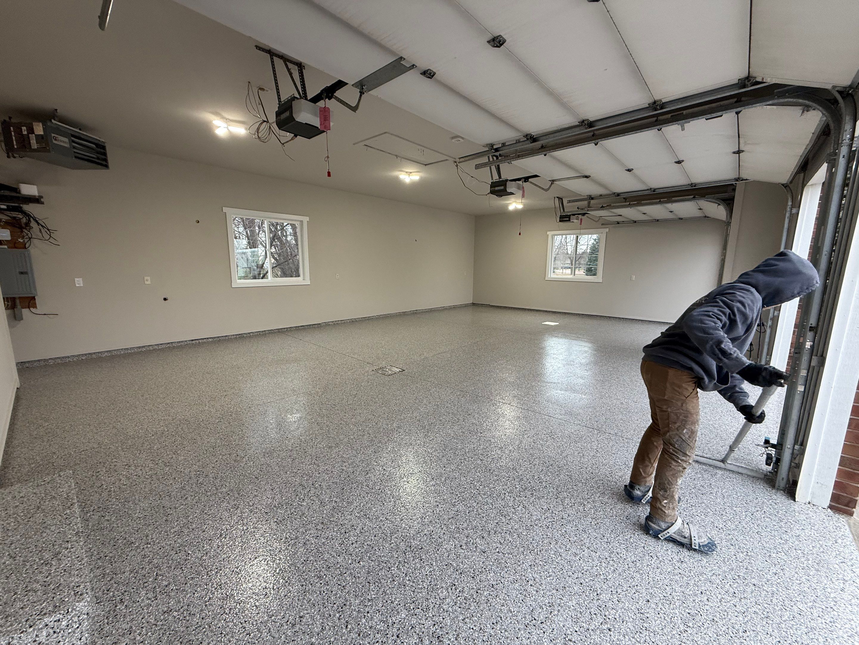 Garage transformation in Yankton by Select Painting, Coatings & Garage Cabinets