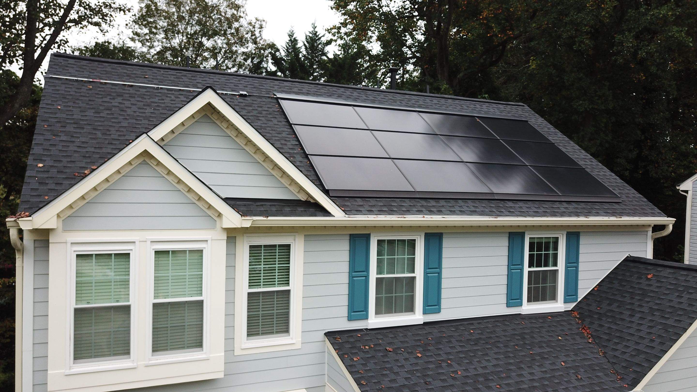 Exterior Home Makeover using GAF Timberline HDZ, GAF Decotech, and James Hardie Siding by American Home Contractors
