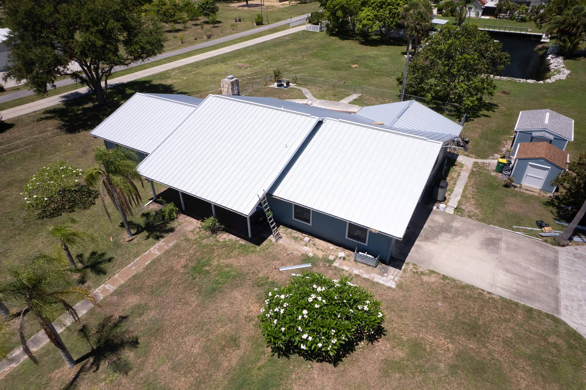 Standing Seam Metal Roof Replacement and Gutter Installation in Merritt Island by Wiedmann Construction & Roofing