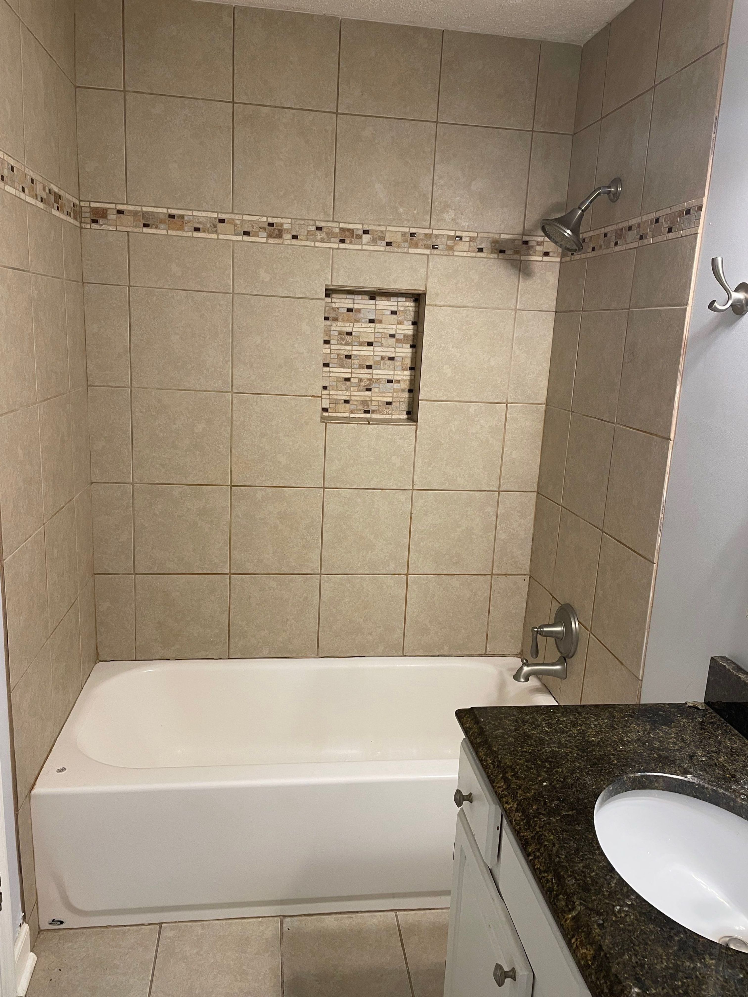 Sleek bathroom shower remodel by Footprints Floors of East Atlanta