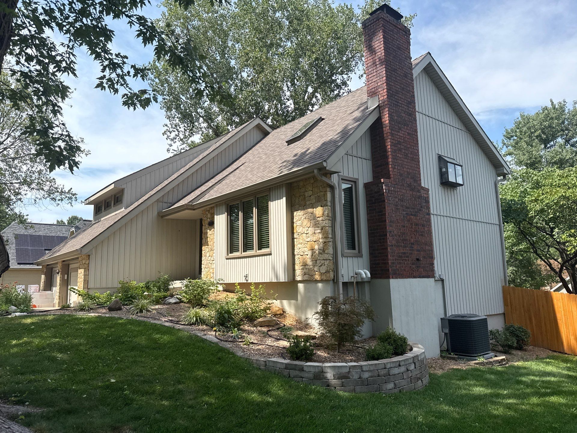 Comprehensive Kansas City Exterior Remodel Featuring Board And Batten Siding by EEC Windows, Siding & Roofing