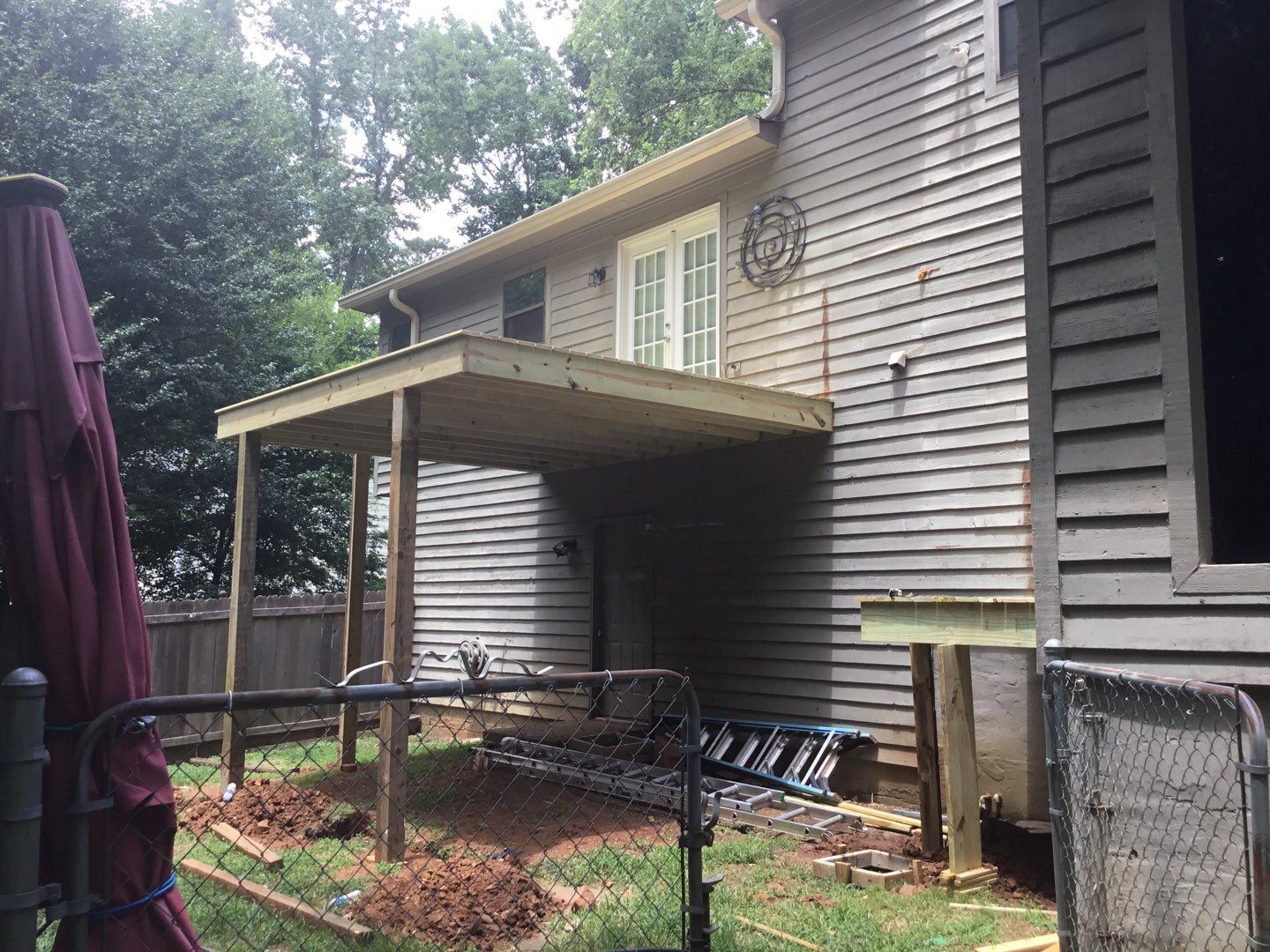 Elevated Wooden Deck and Front Porch Renovation in Marietta by Swift Home Renovations 