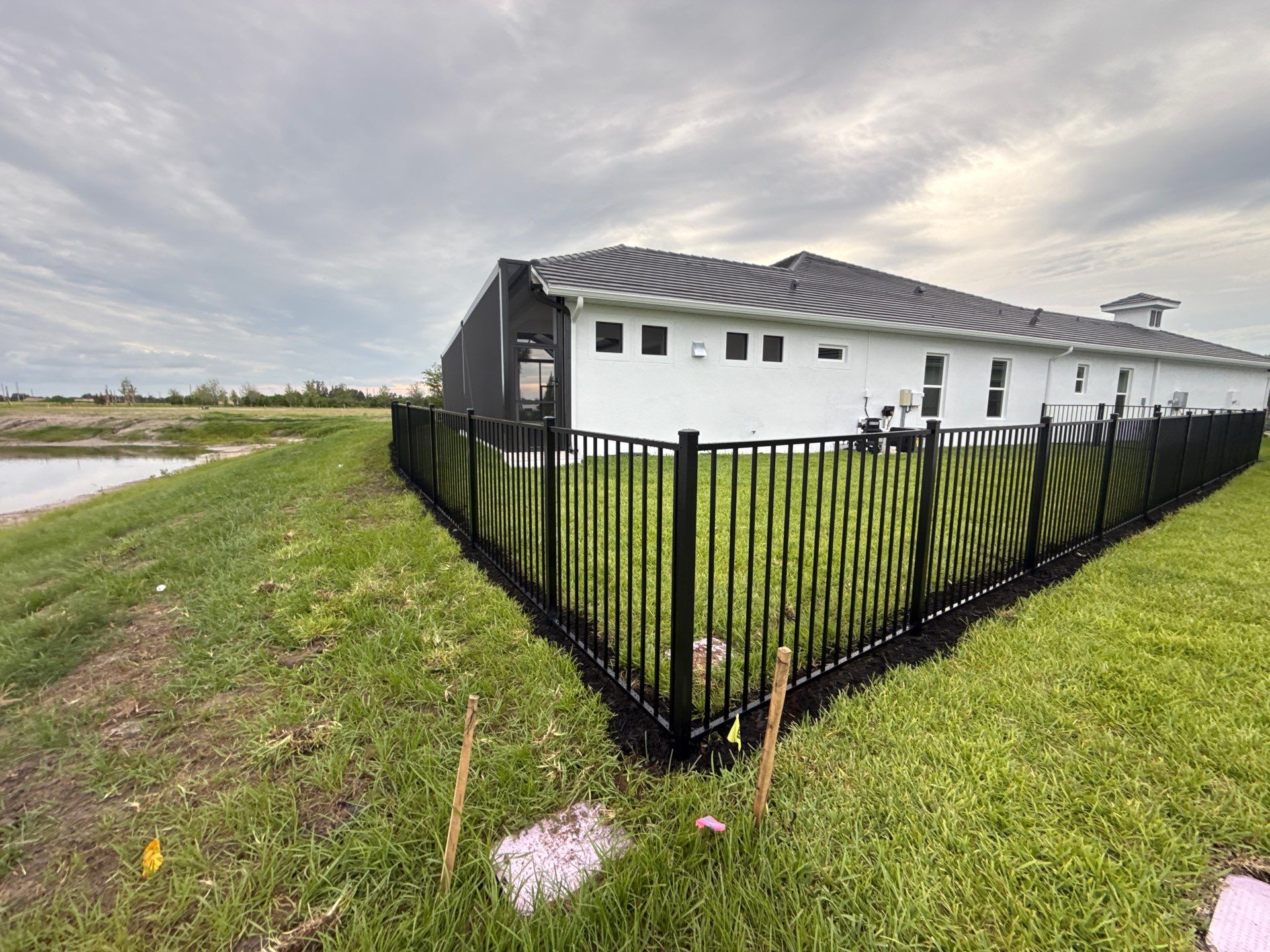 Black Aluminum Picket Fence Installation in Venice, Florida by True Fence LLC