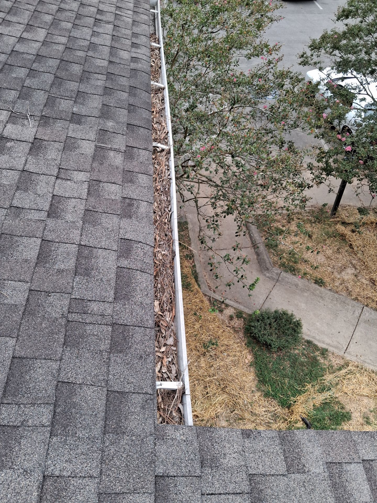 Commercial gutter cleaning Little Rock, AR before photo with filled gutters