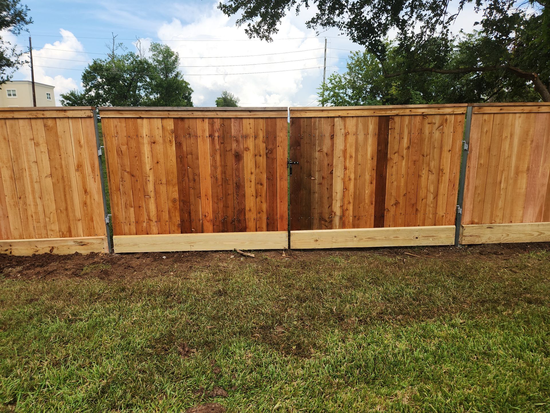 Wood Fence Installation for HOA by Tim's Fences