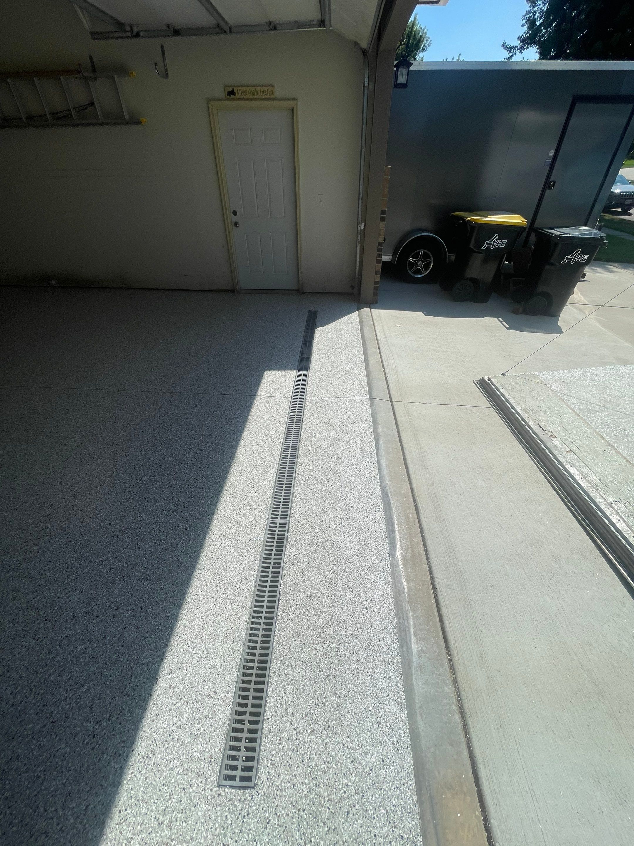 Multi-Stall Garage Floor Coating Installation in Sioux Falls by Select Painting, Coatings & Garage Cabinets