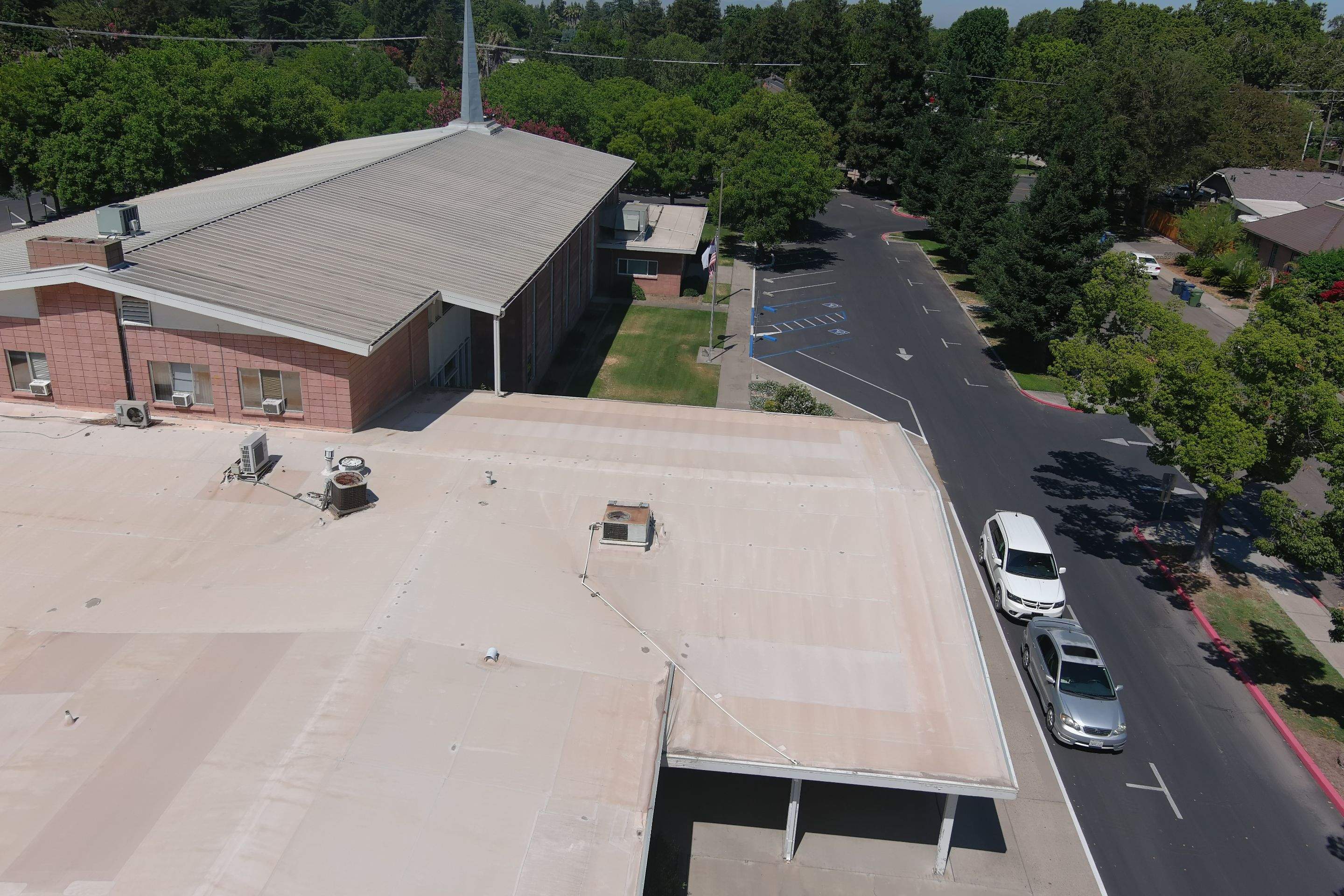 MR Roofing system using Benchmark/PUMA XL coatings over TPO single-ply roofing by Straight Edge Roofing Inc
