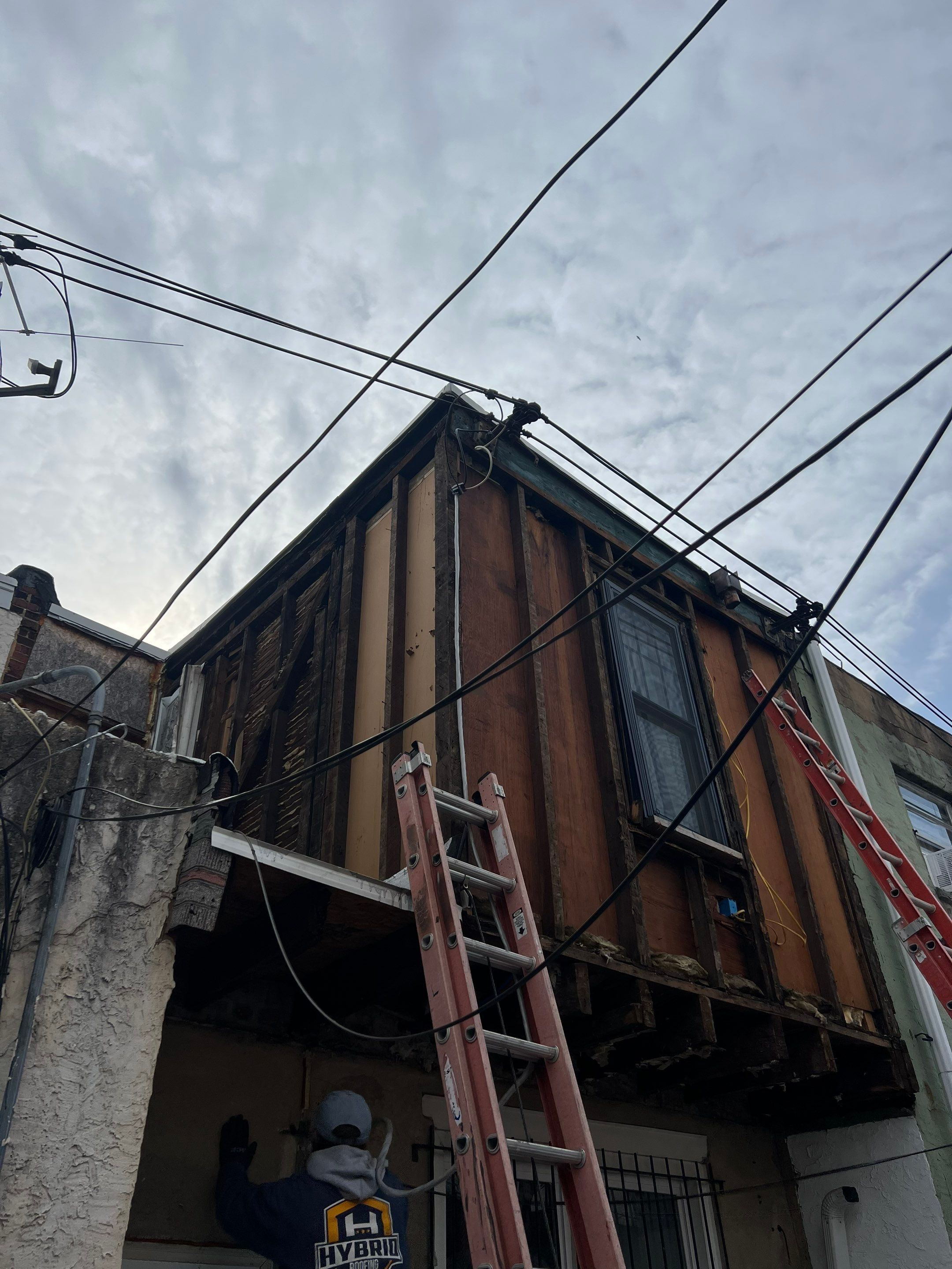 Vertical Black Metal Siding Installation for Philadelphia Home Exterior by Hybrid Roofing And Renovations