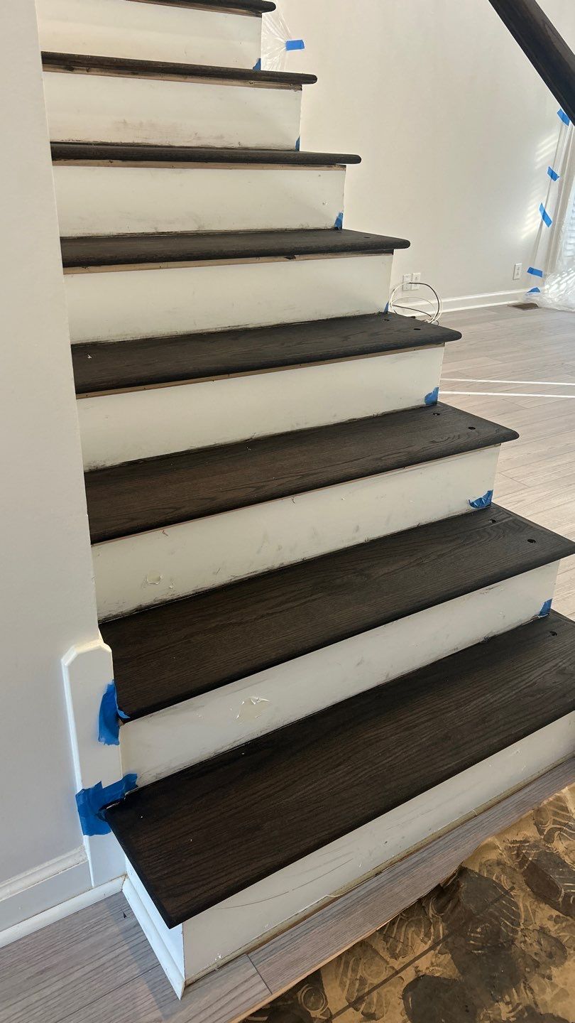 Updated staircase and hallway by Footprints Floors of Nashville