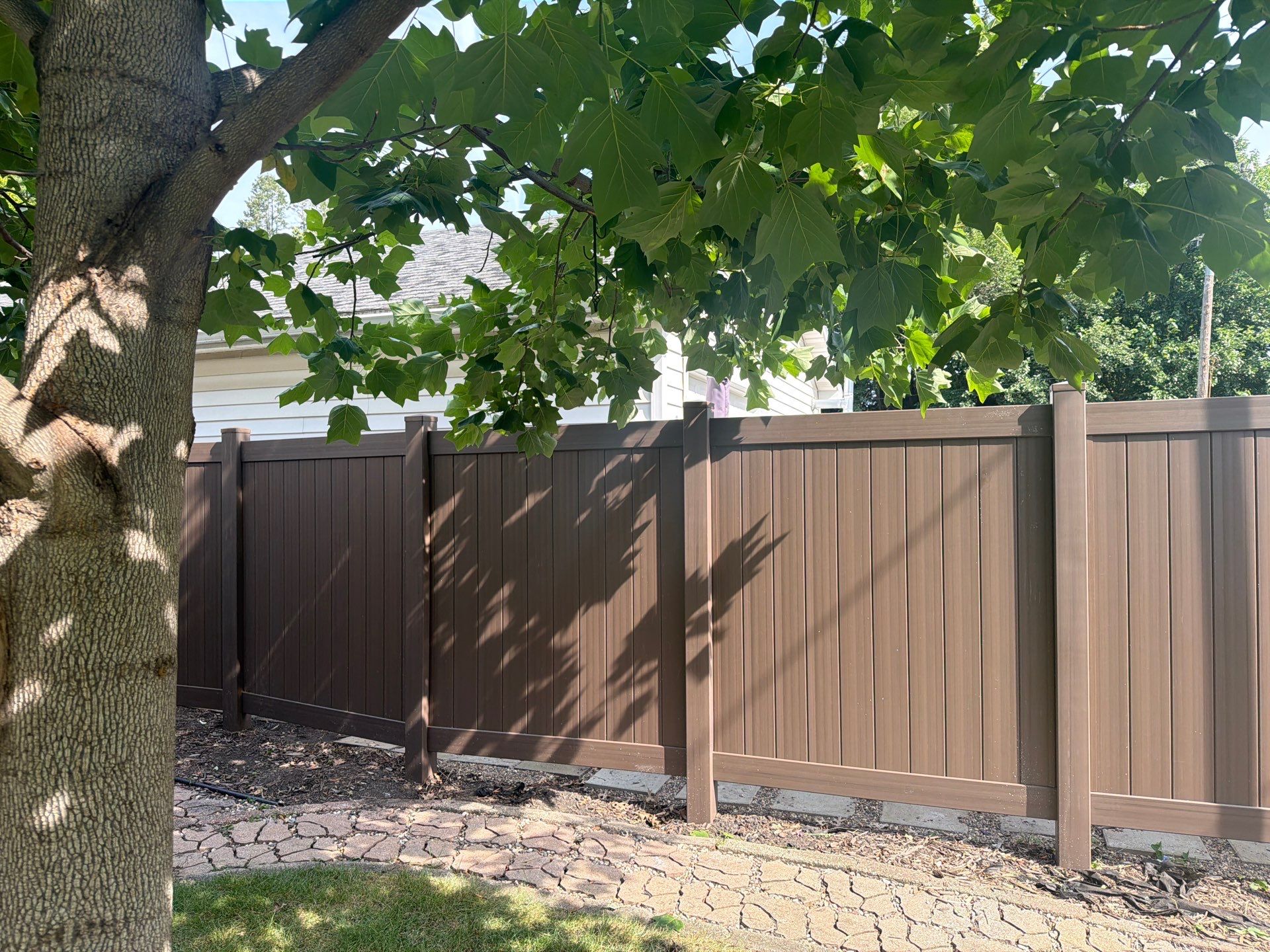 Walnut Vinyl Privacy Fence Installation in Waterloo by Perfect Picket Fence and Stain