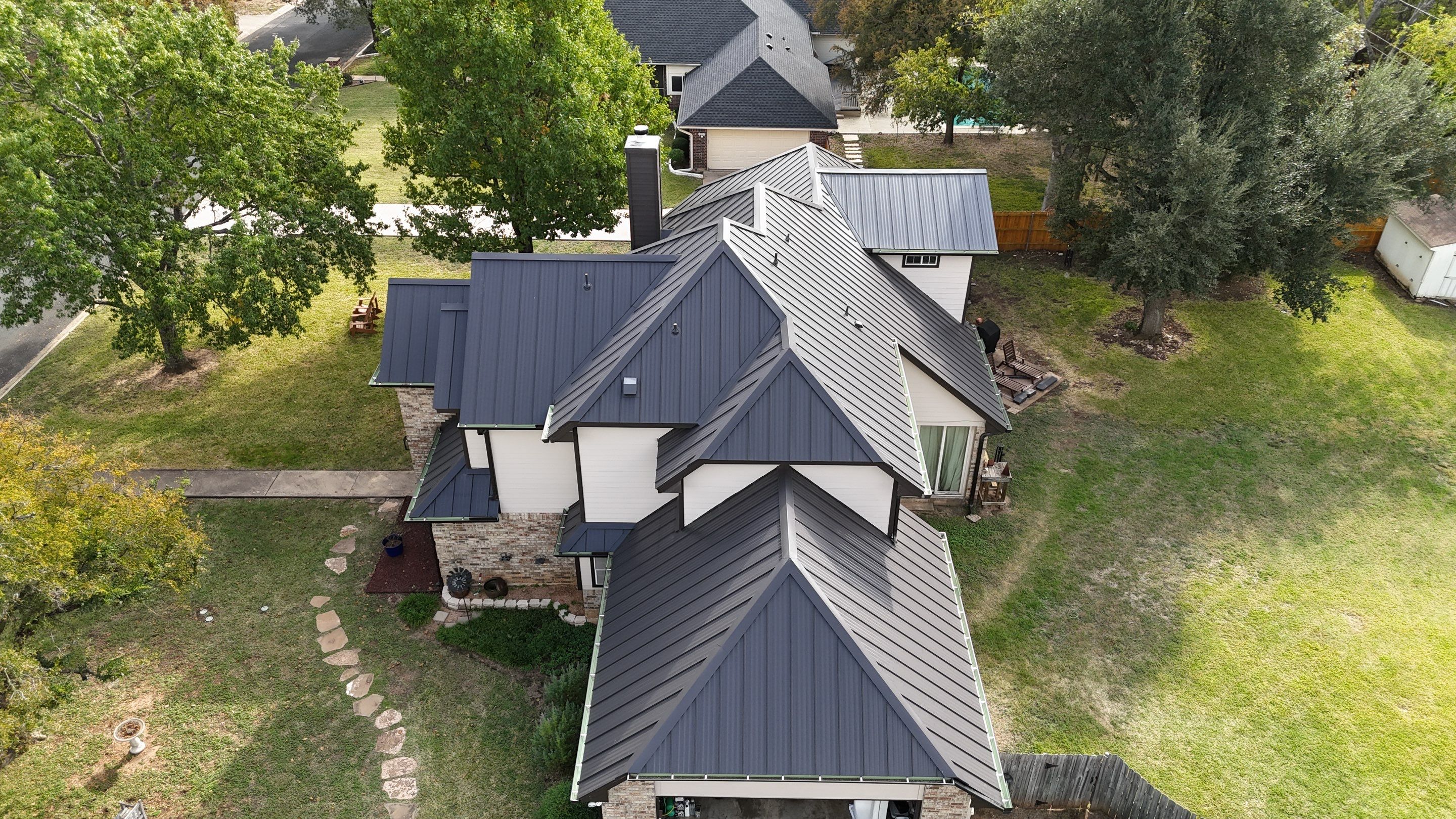 Residential Roof Replacement using 24 GA Double-Lock - Matte Black by Action Exteriors Austin