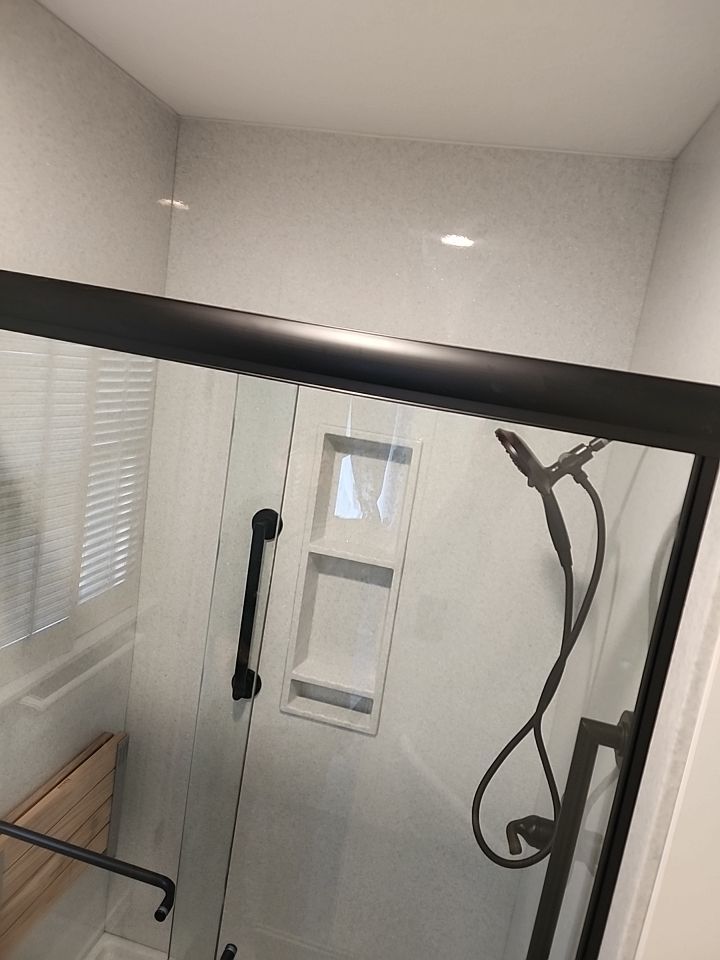 New shower, flooring, and countertop by The Shower Company