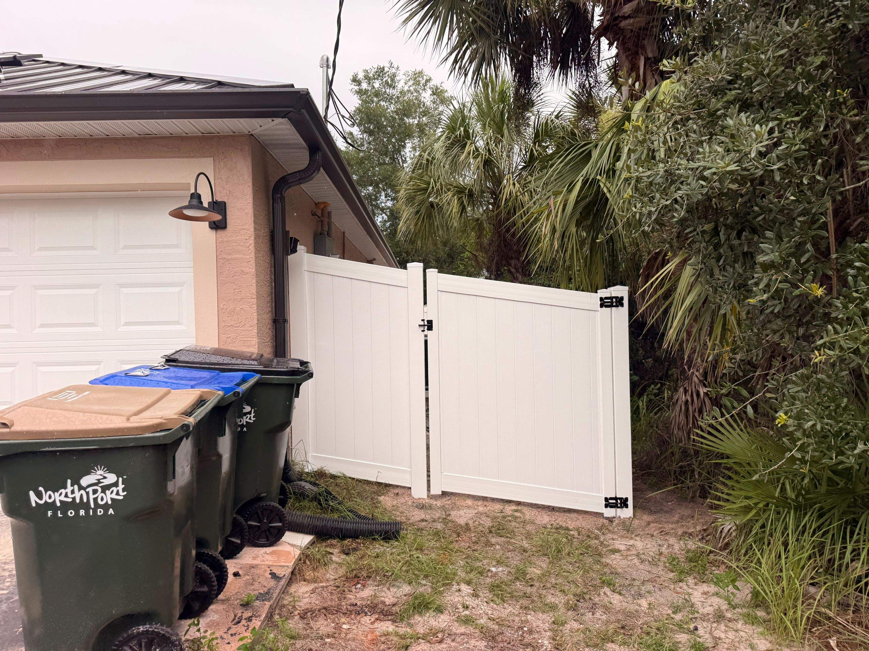 Vinyl Privacy Fence and Double Gate Installation in North Port by True Fence LLC