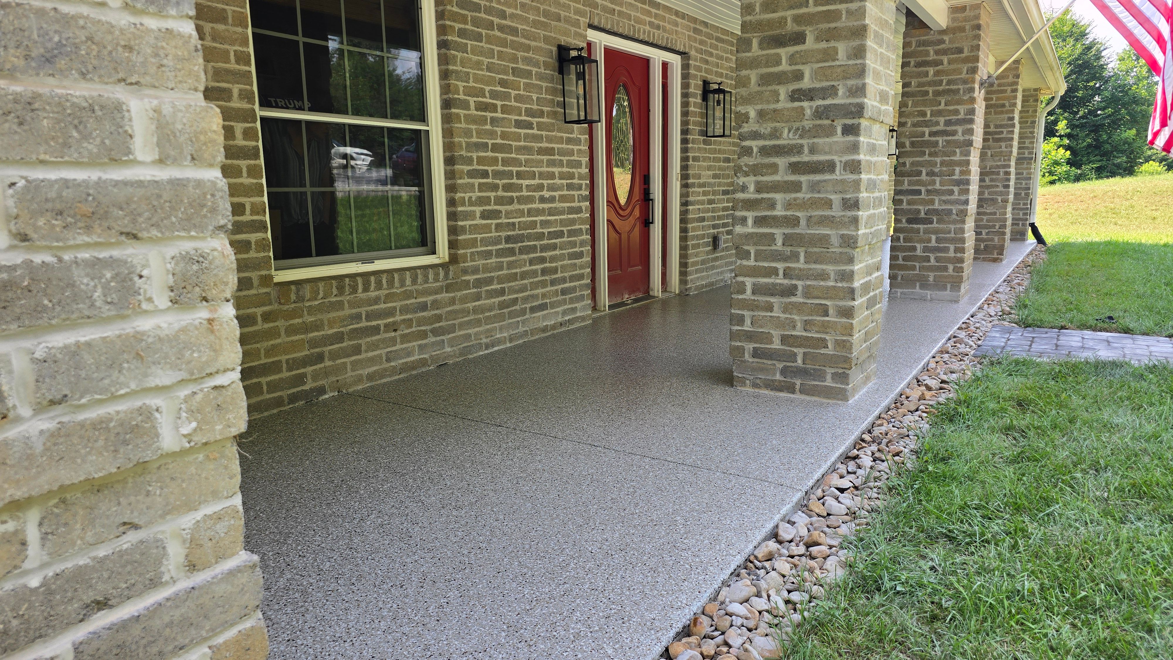 Back Patio using Creekbed by Elite Floor Solutions