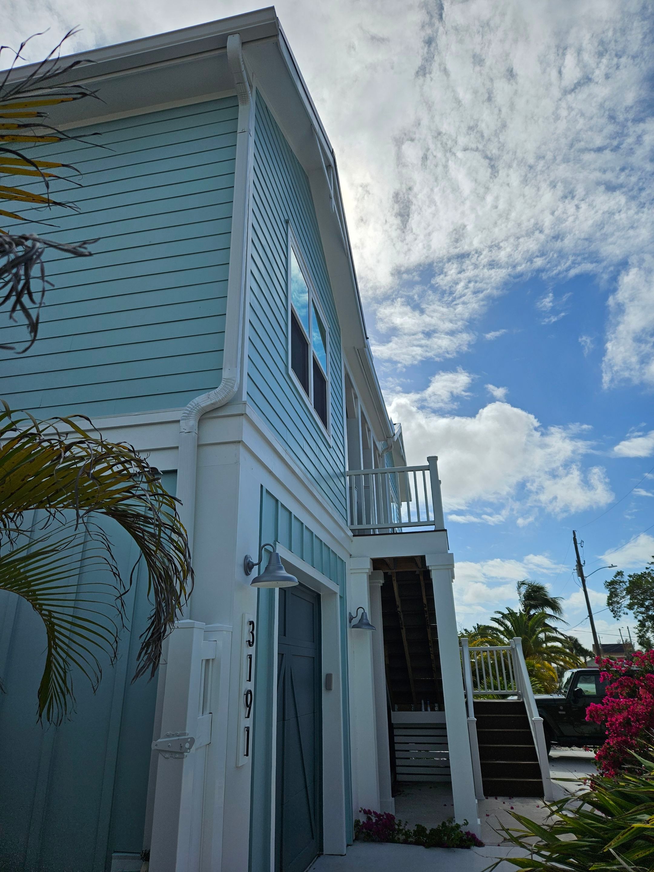 New White Seamless Gutters Installation and Downspouts, Reseal Gutters in Fort Myers Beach, FL  by Gutter Professors
