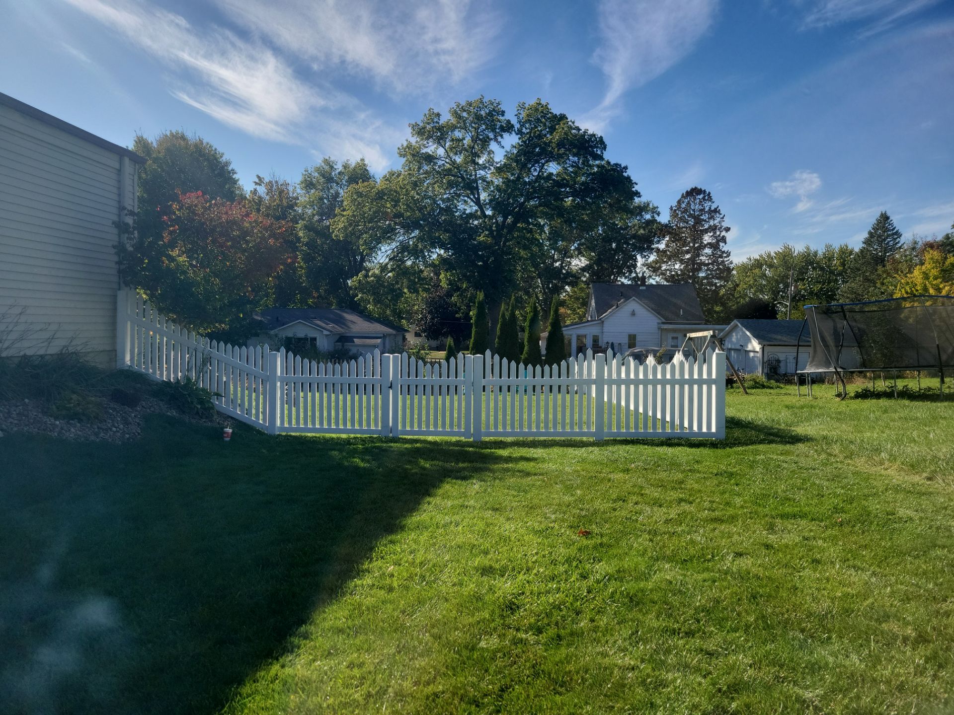 White Vinyl Spaced Picket Fence Installation in Waterloo by Perfect Picket Fence and Stain