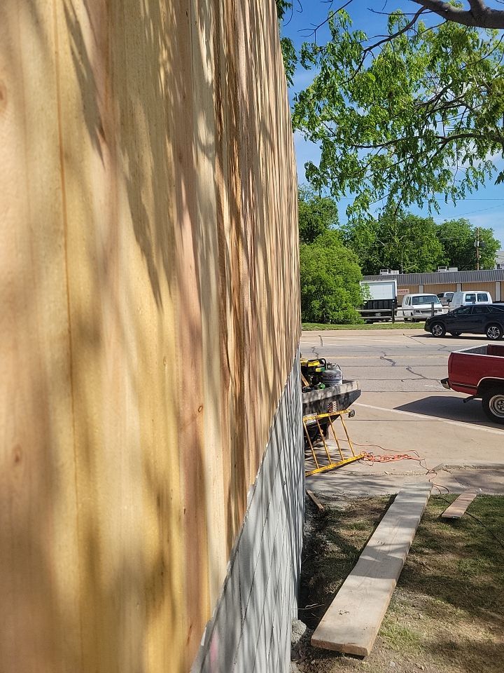 Cedar Fence using Cedar Pickets and Metal Poles by Clays Services Inc