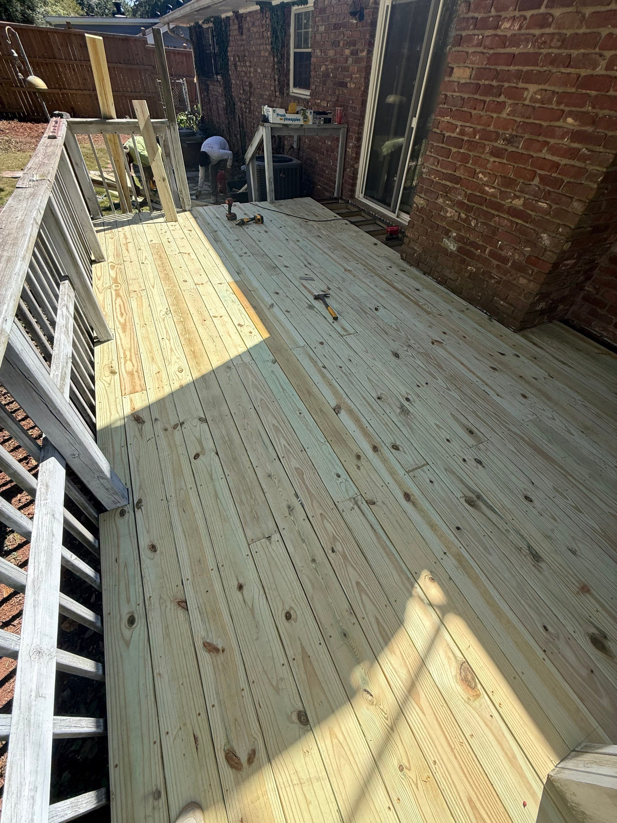 Pressure-Treated Wood Deck Replacement and Railing Installation in Marietta by Swift Home Renovations 