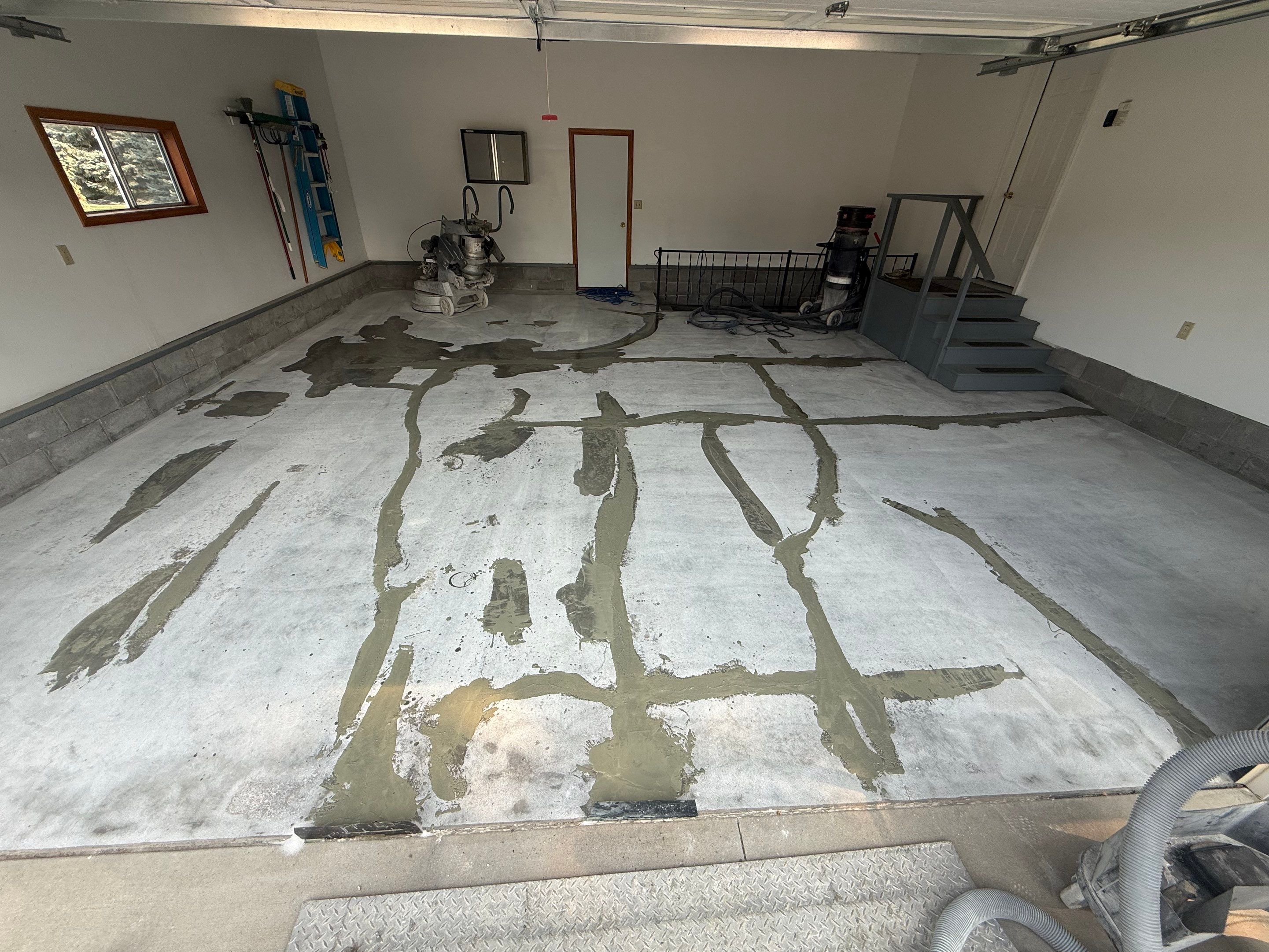 Feather Grey Garage Floor Coating and Concrete Restoration in Mitchell by Select Painting, Coatings & Garage Cabinets