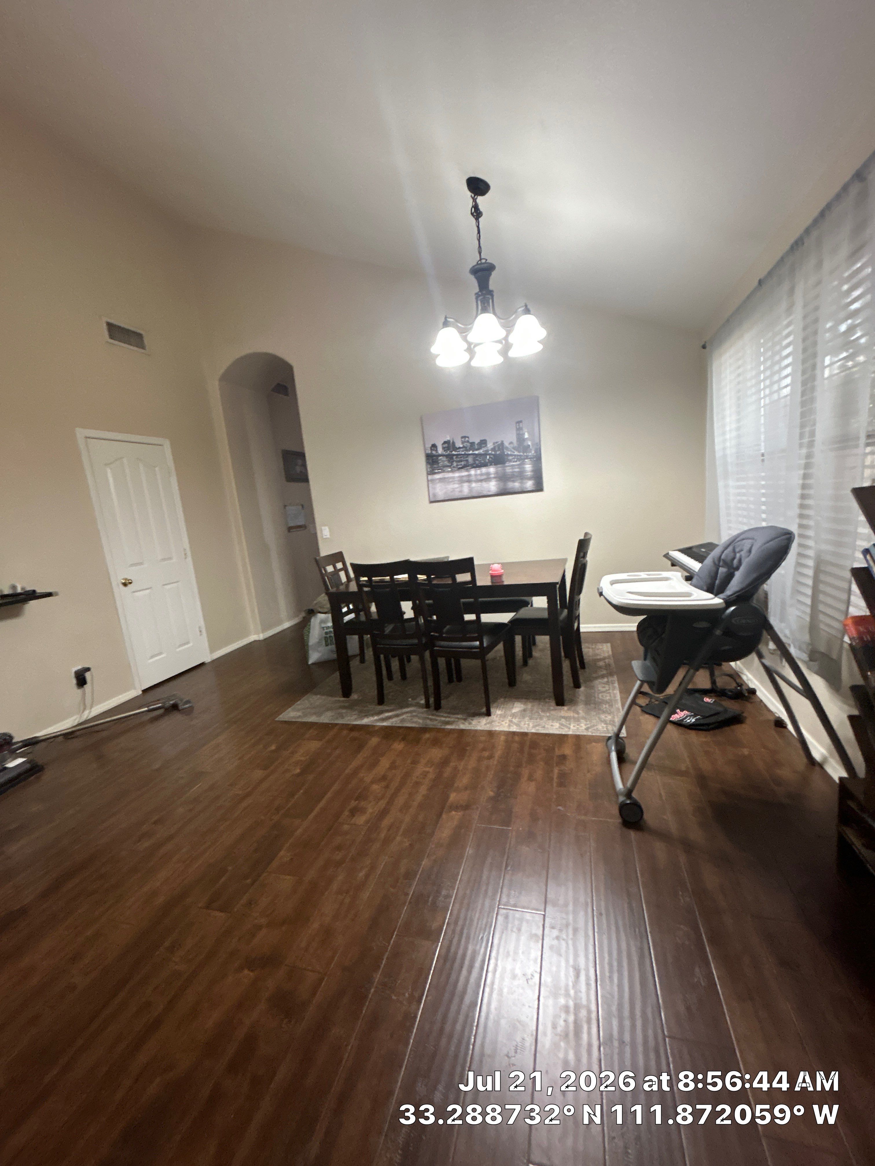 Dark Wood Laminate Flooring Installation in Chandler Dining Room by CompanyCam Sales Demo