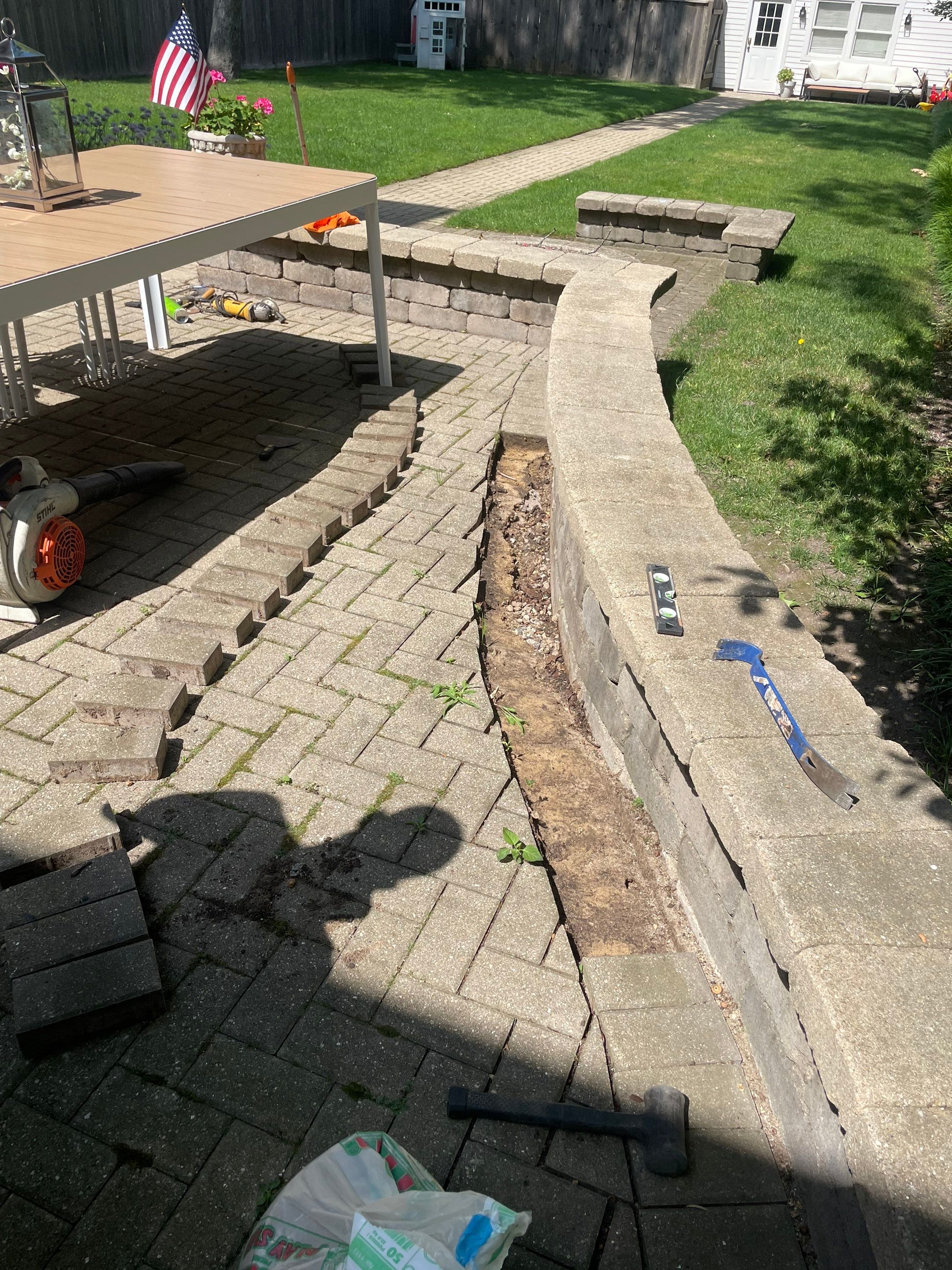 Brick patio repair, clean sand and seal by Northern Power Washing LLC.