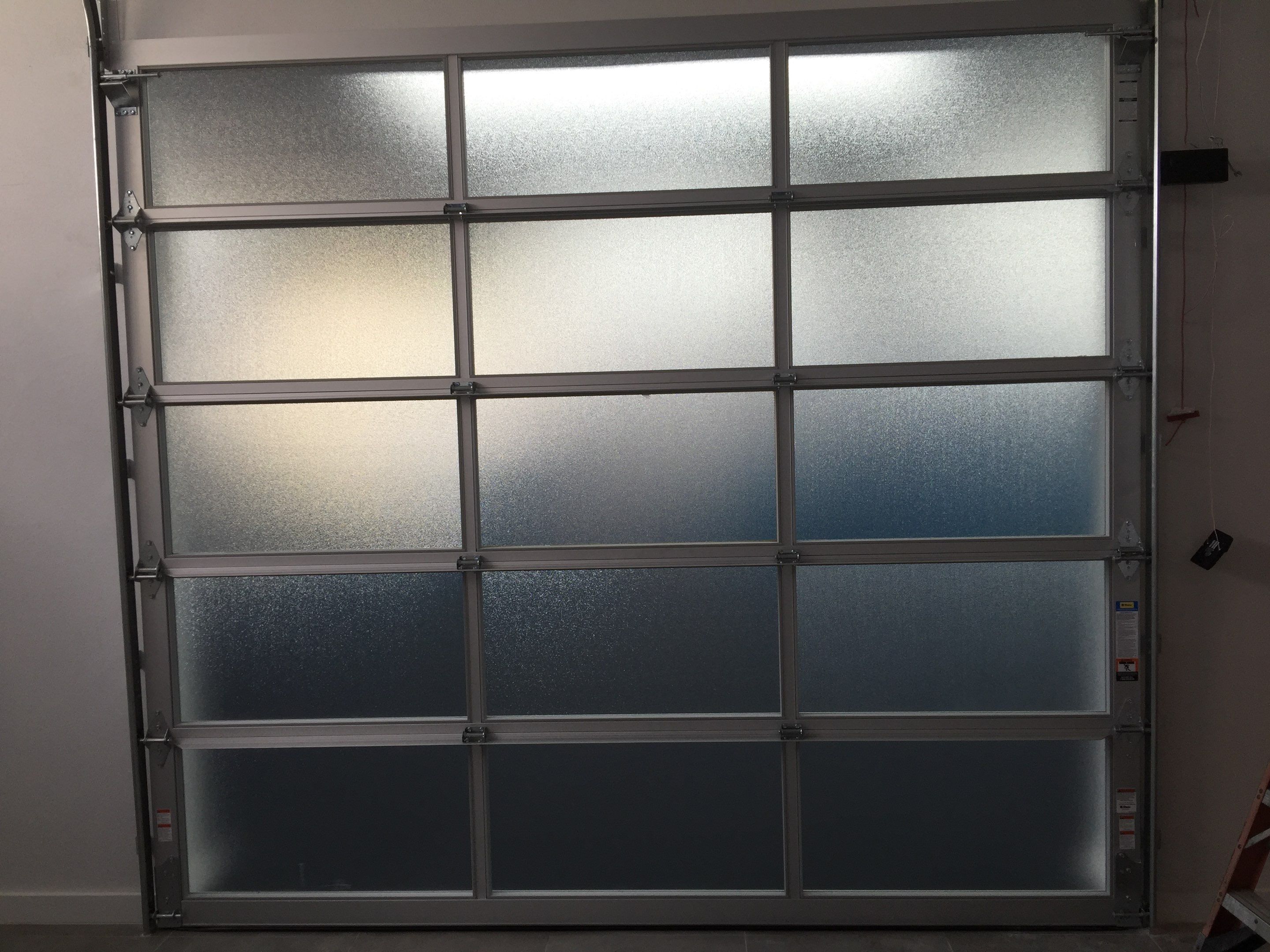 Clopay Avante, Aluminum and Glass Garage Door in Fort Lauderdale by The Door Doctor of South Florida, Inc.
