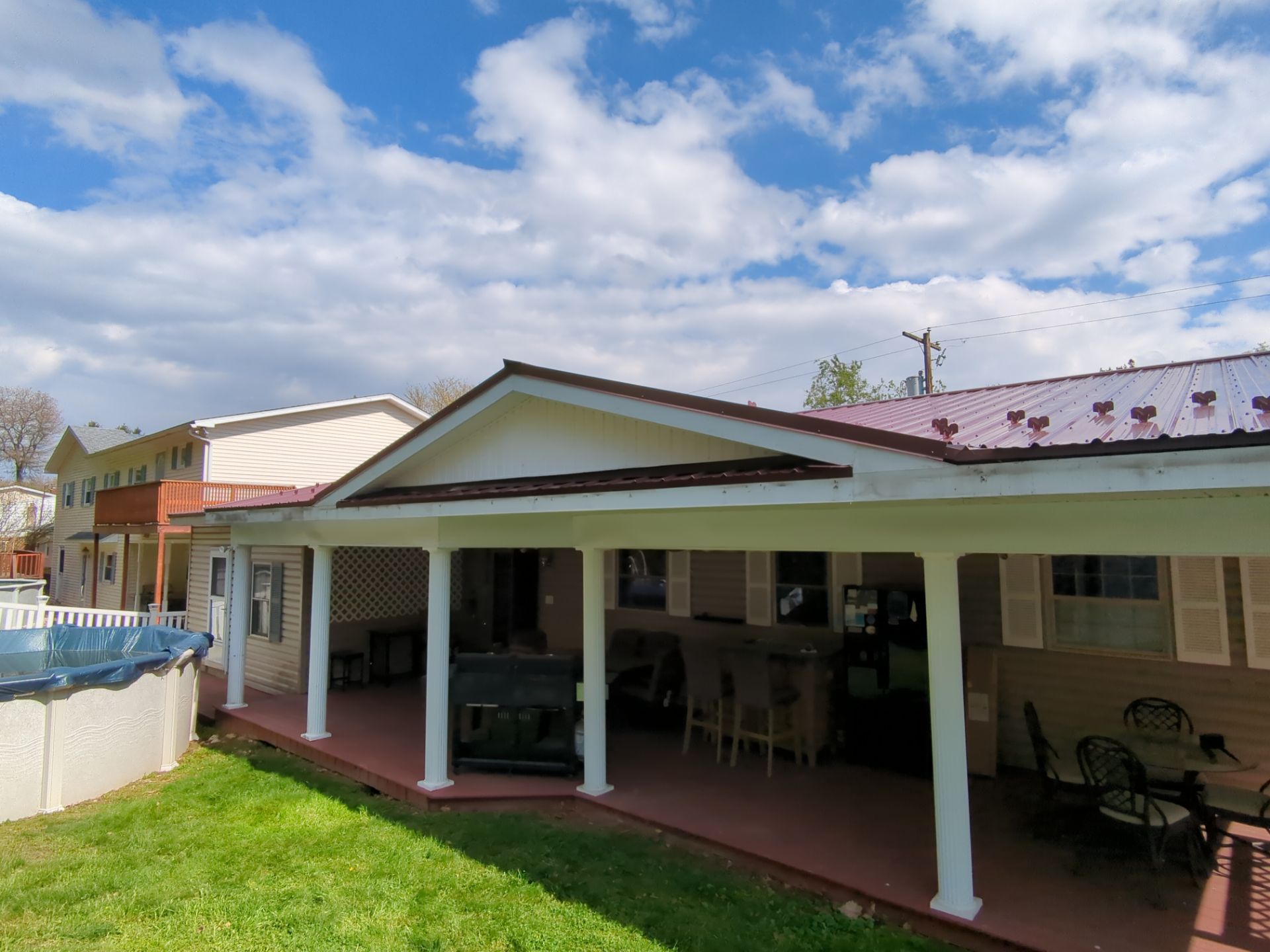 Maroon ABM Metal Roof Replacement and Gutter Installation in Shenandoah by Esh Builders