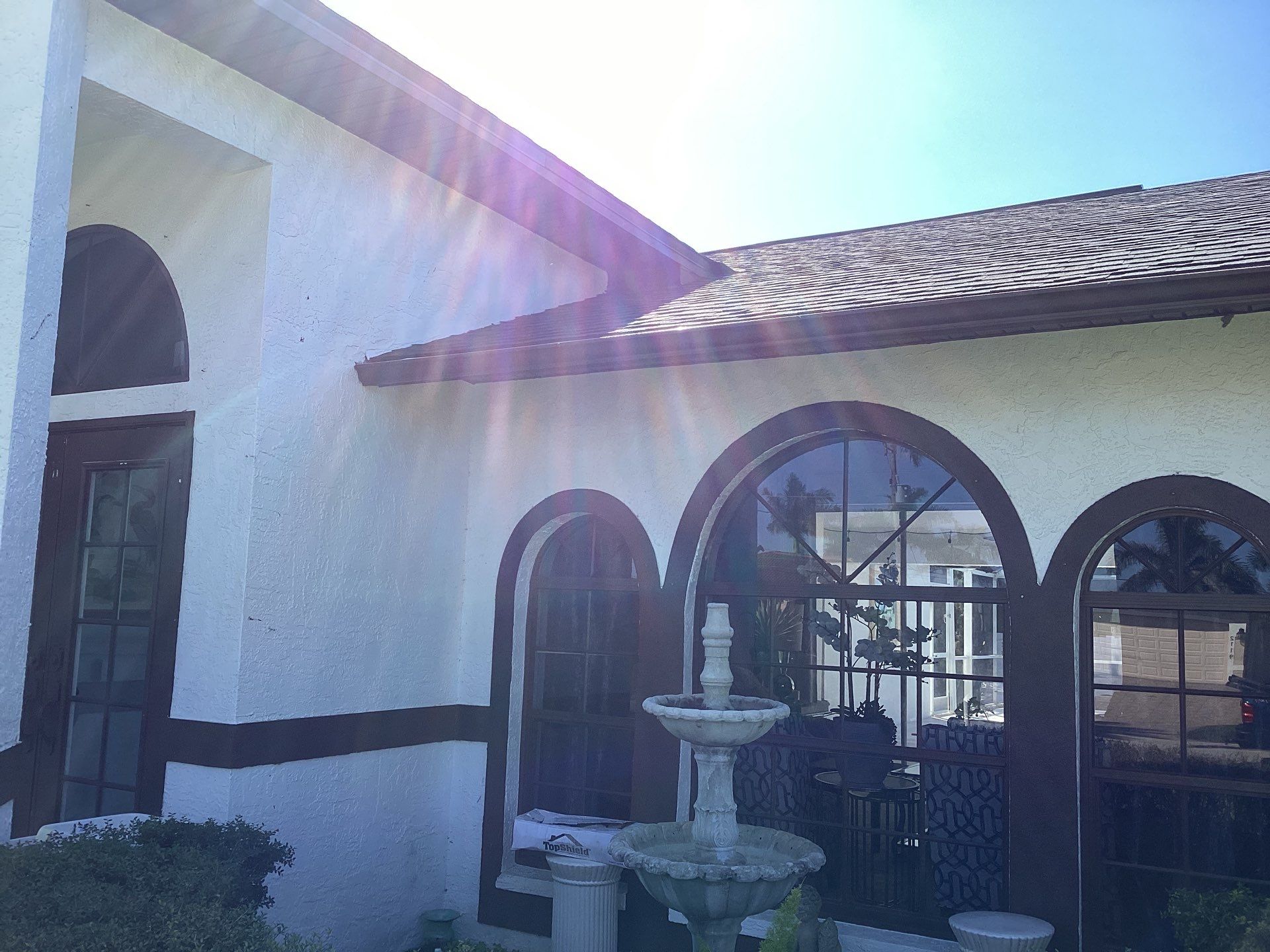 Brown Gutter + White and Brown Downspouts in Cape Coral FL by Gutter Professors