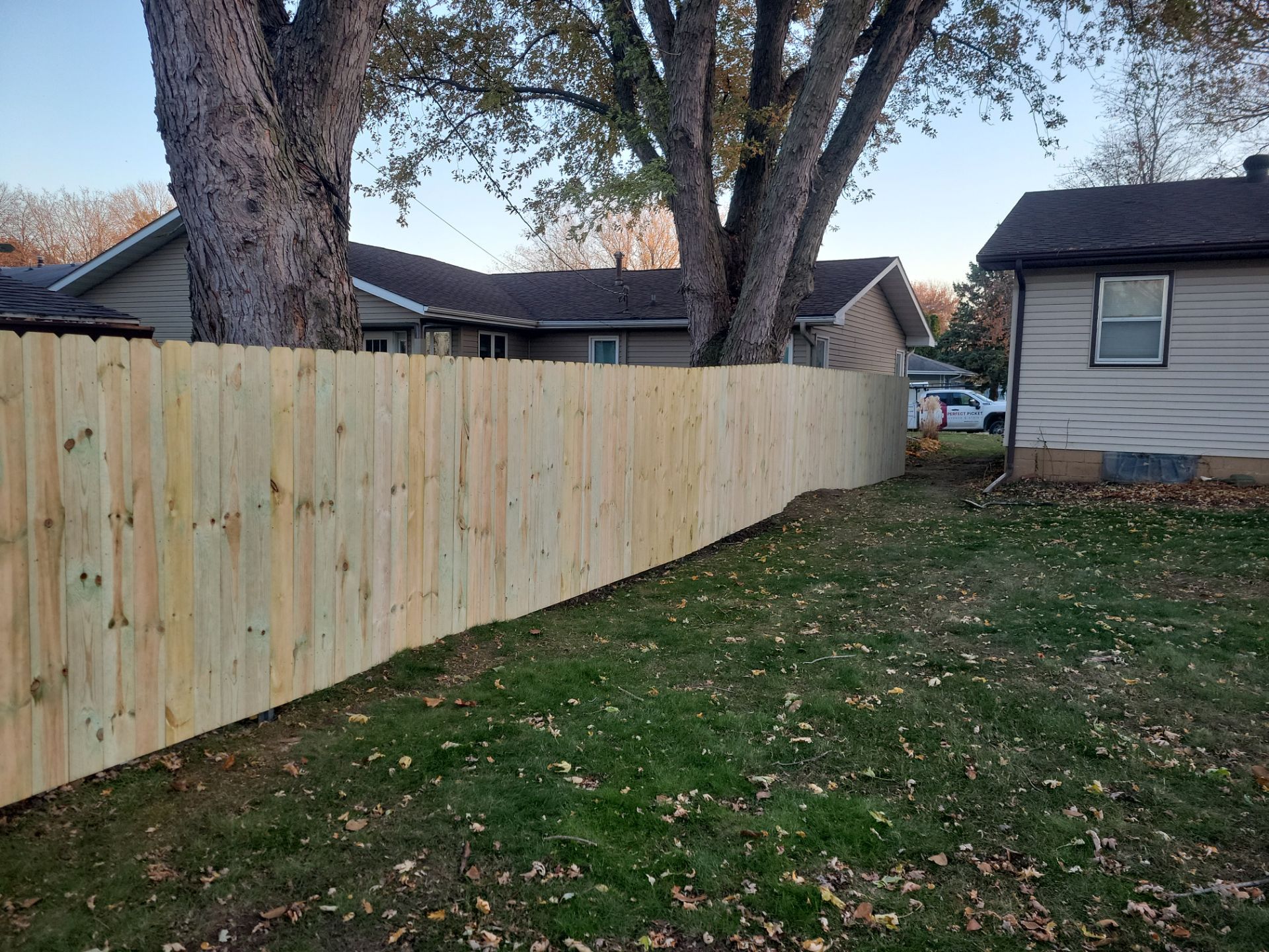 New Pressure-Treated Wood Privacy Fence and Gate in Charles City by Perfect Picket Fence and Stain
