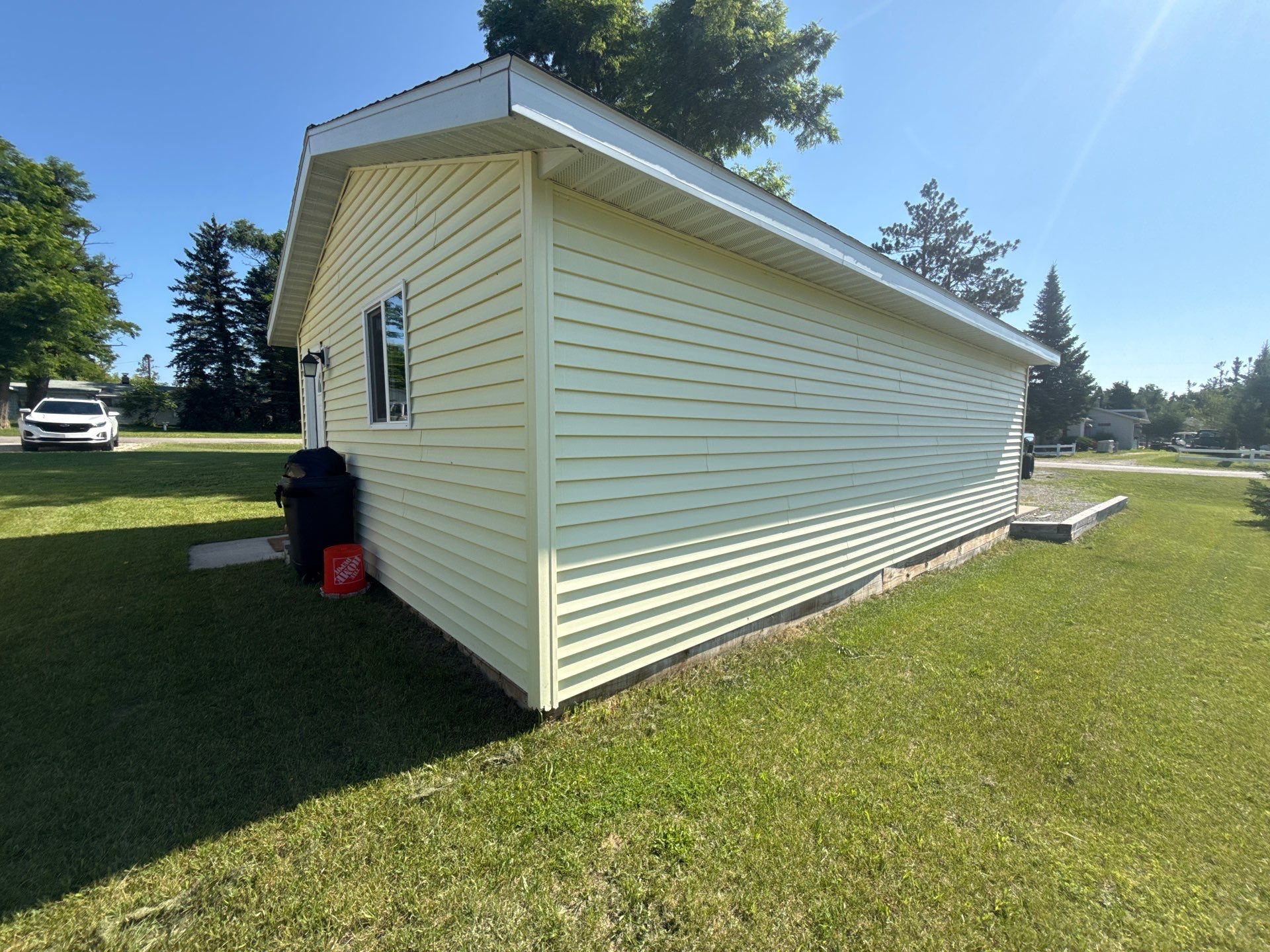 White Gutter and Downspout Installation for Lewiston Residence by Rainbow Seamless Systems