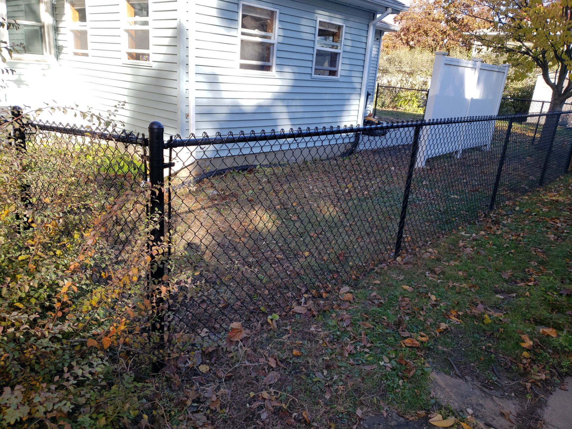 Black Chain Link Fence Installation in Cedar Falls, Iowa by Perfect Picket Fence and Stain