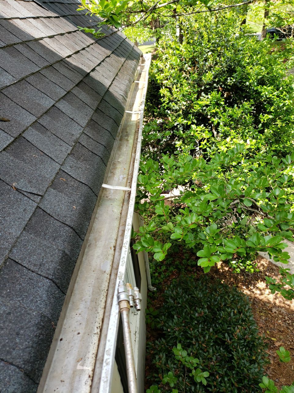 Gutter Cleaning using water by Power Wash Masters LLC