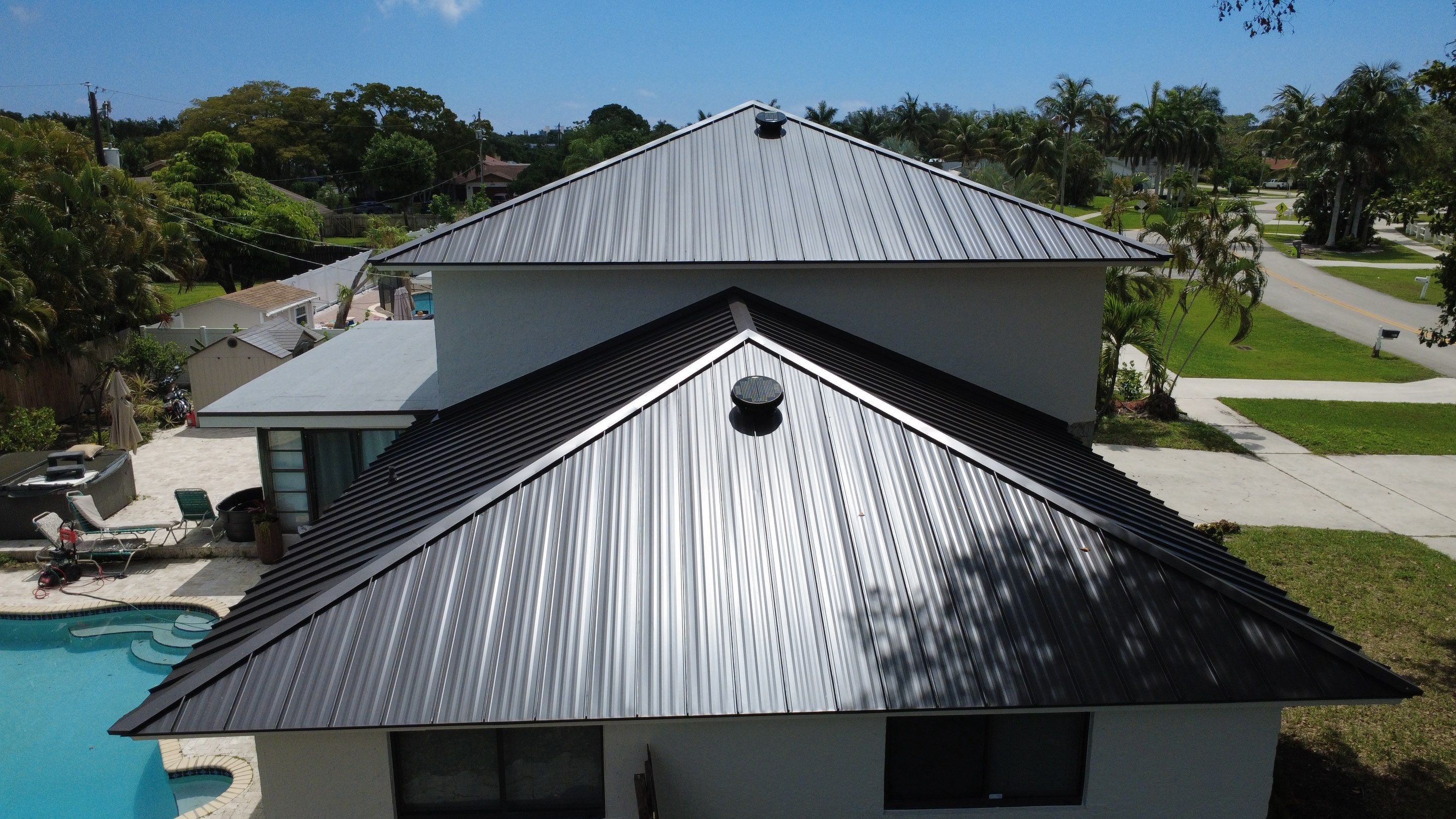 Residential Roofing Installation using 1.5'' Mechanical Seam by BLUES BROTHERS ROOFING