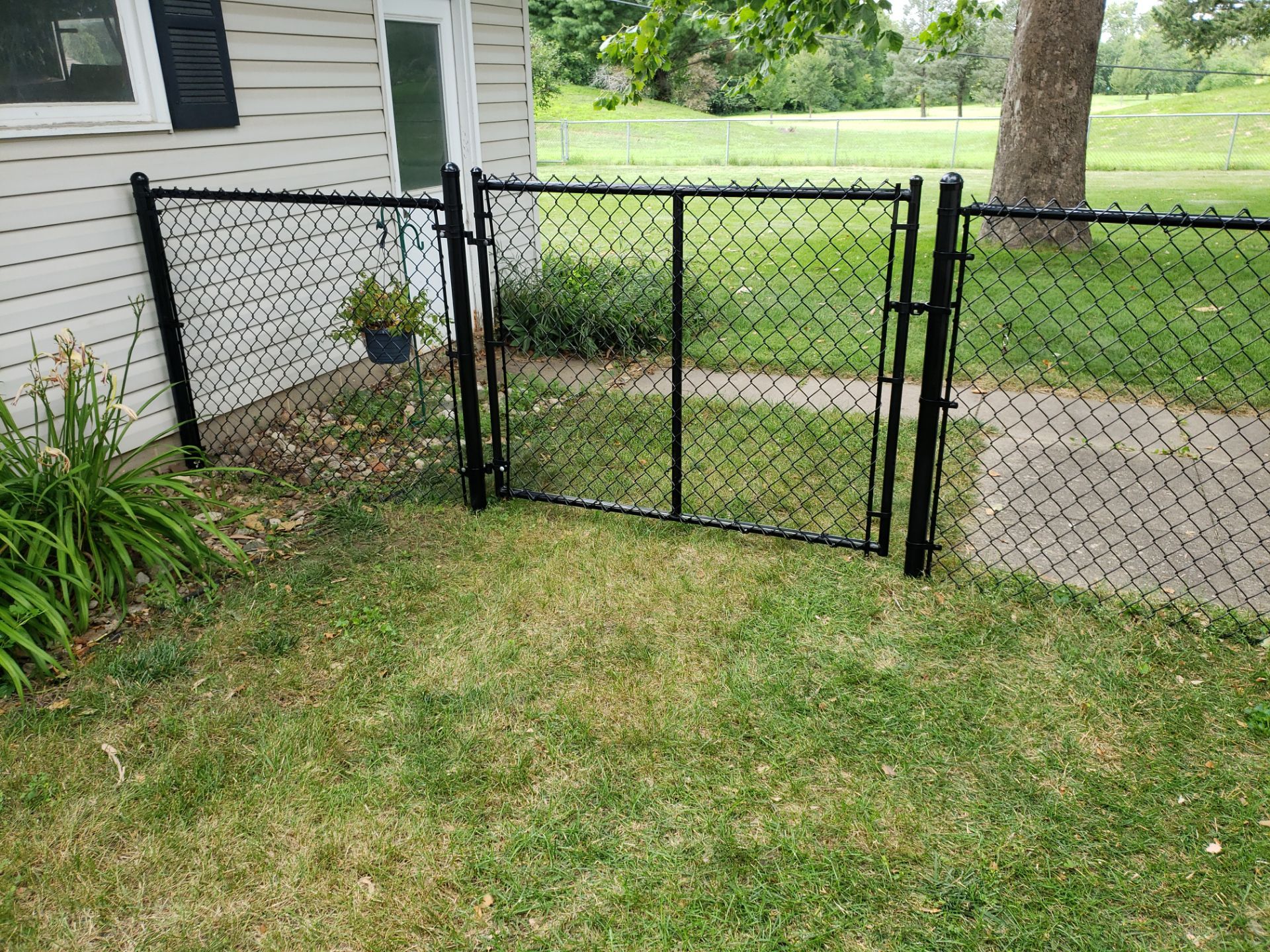 Black Chain Link Fence Installation in Cedar Falls by Perfect Picket Fence and Stain