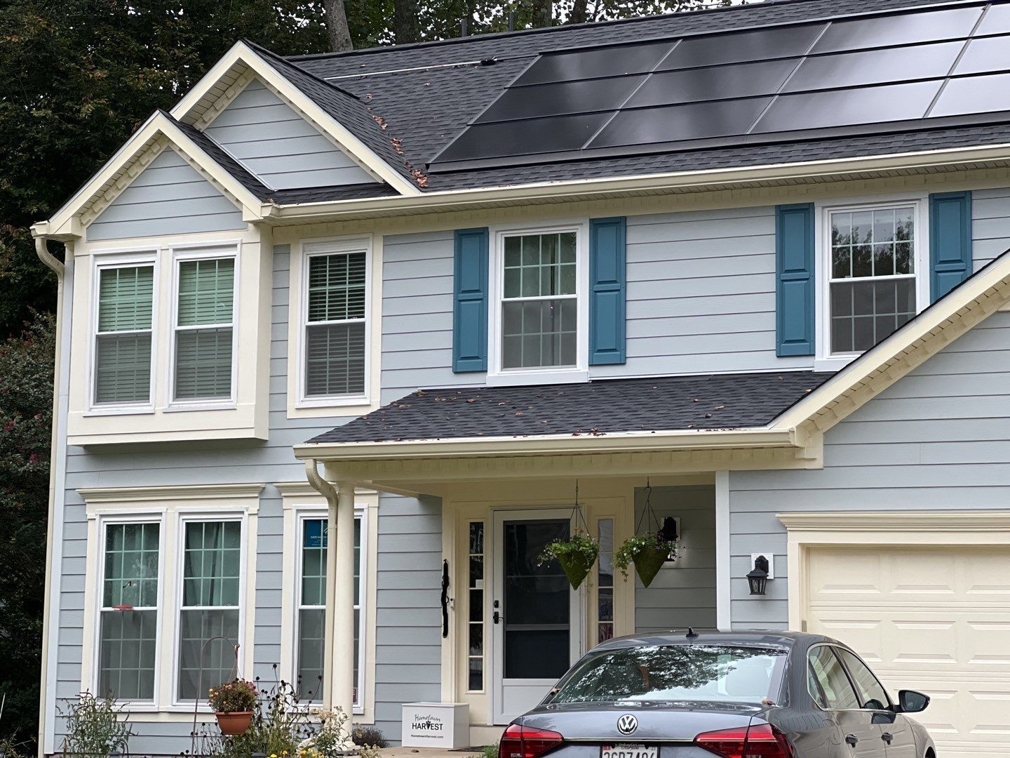Exterior Home Makeover using GAF Timberline HDZ, GAF Decotech, and James Hardie Siding by American Home Contractors