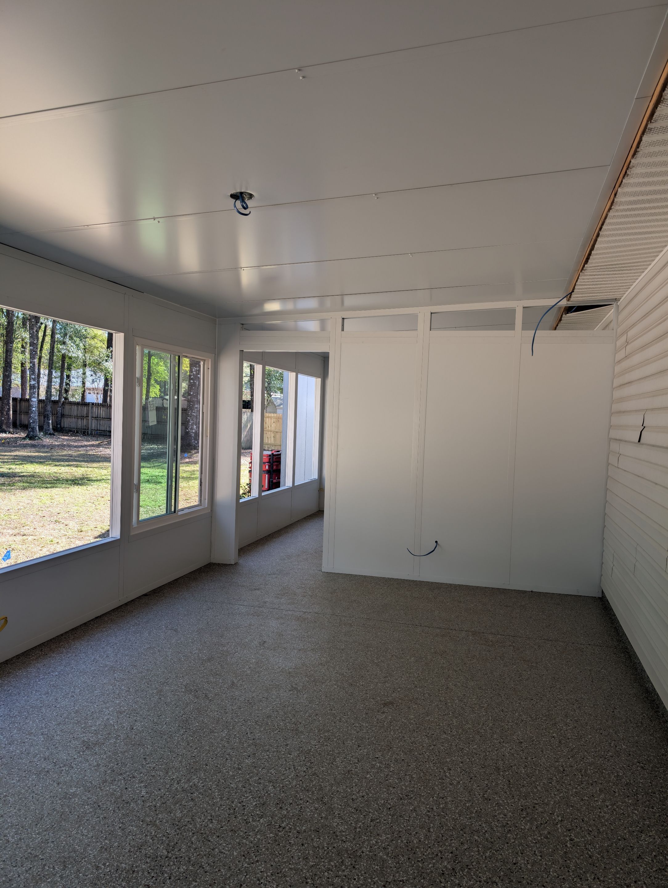 Large Divided Glass Room with Patio cover by Titan Sunrooms