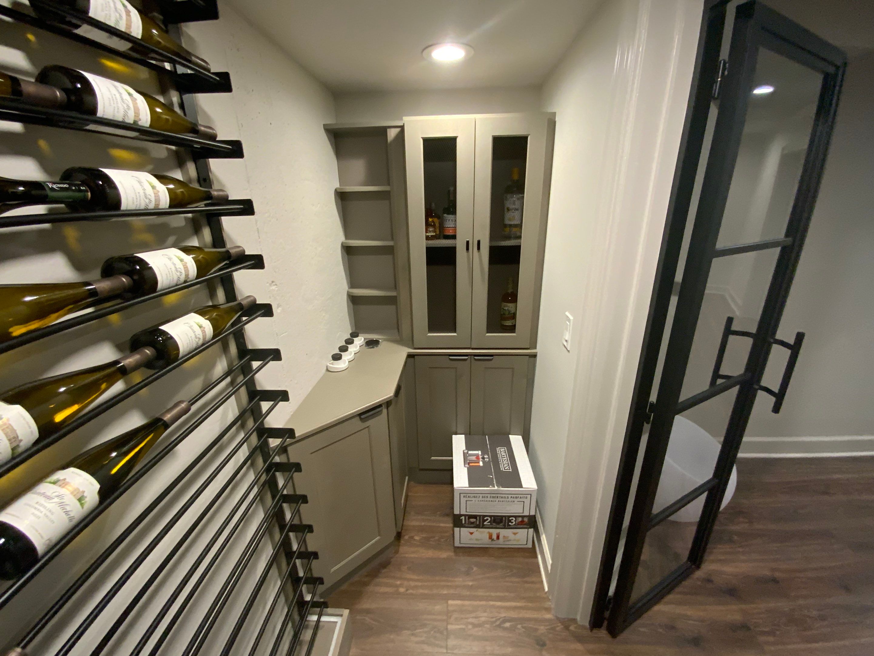 Finished Basement Renovation Featuring Home Theater and Custom Wine Cellar by Swift Home Renovations