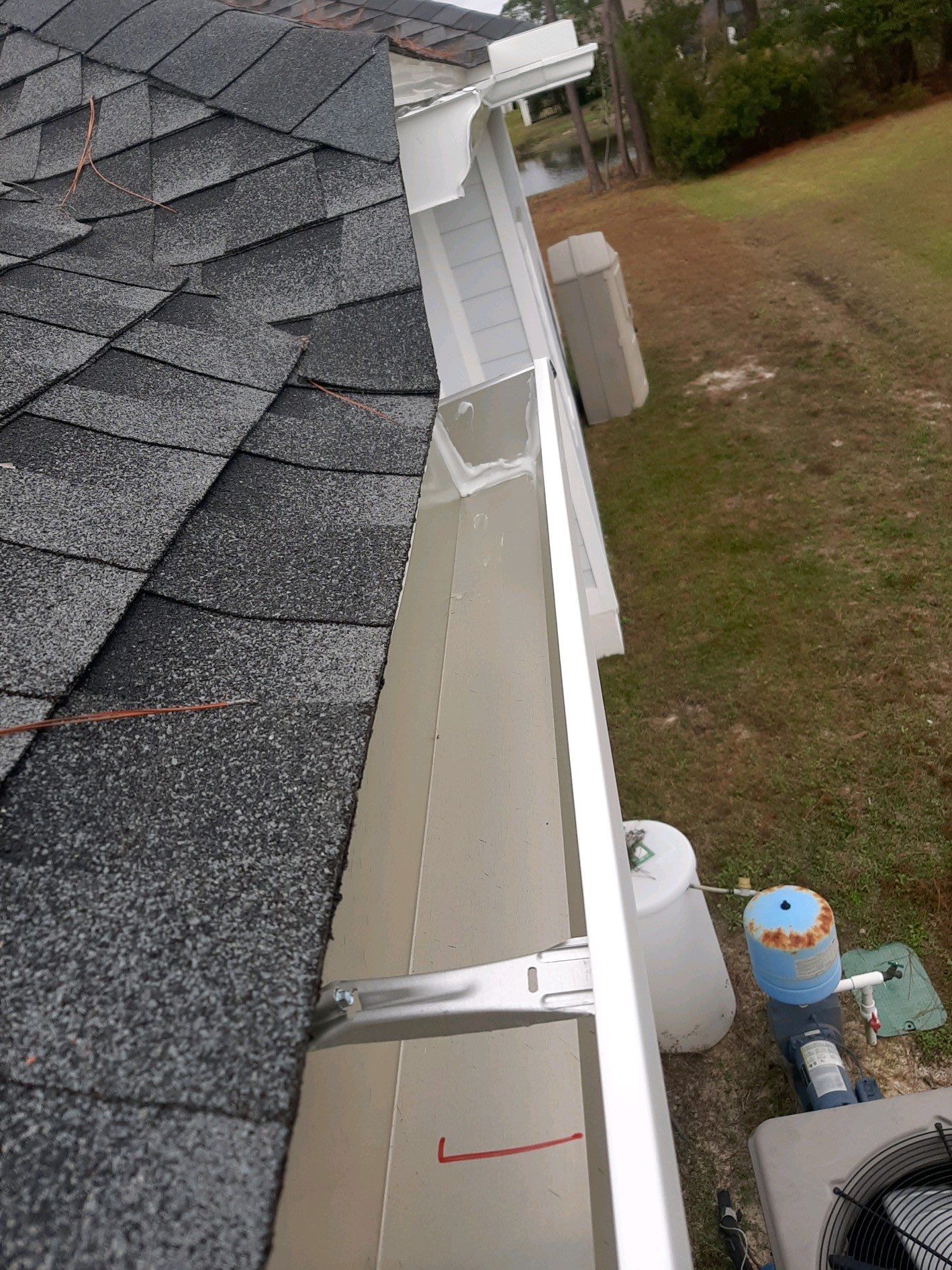 Gutter Installation using White K-Style Seamless Gutters by Gutter Professors