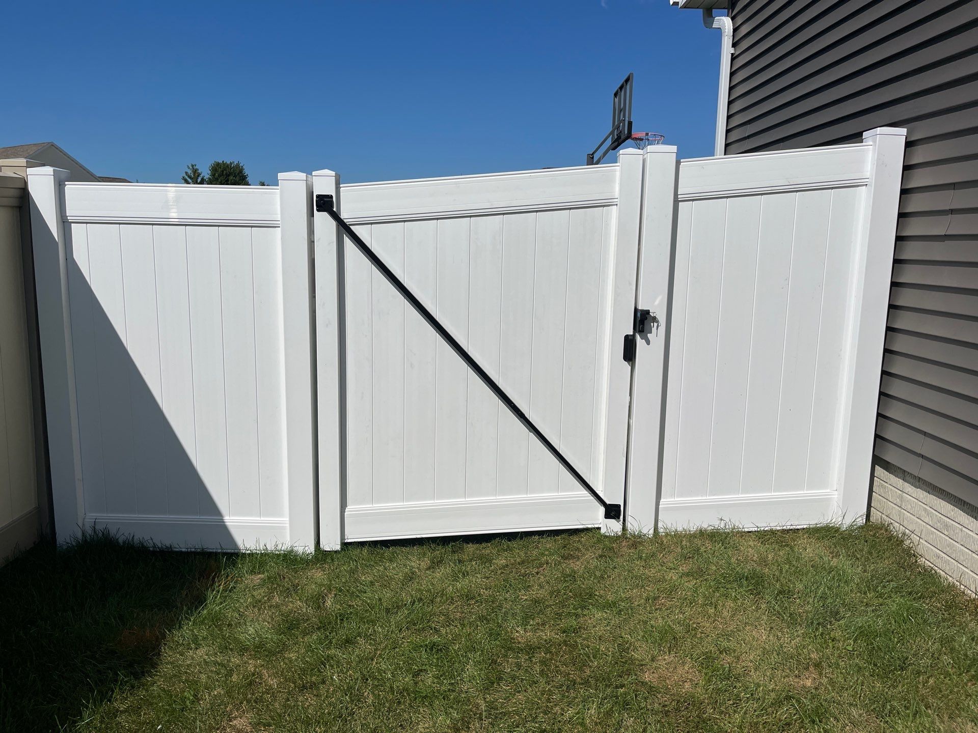 New Vinyl Privacy Fencing and Gates for Waterloo Residential Backyard by Perfect Picket Fence and Stain