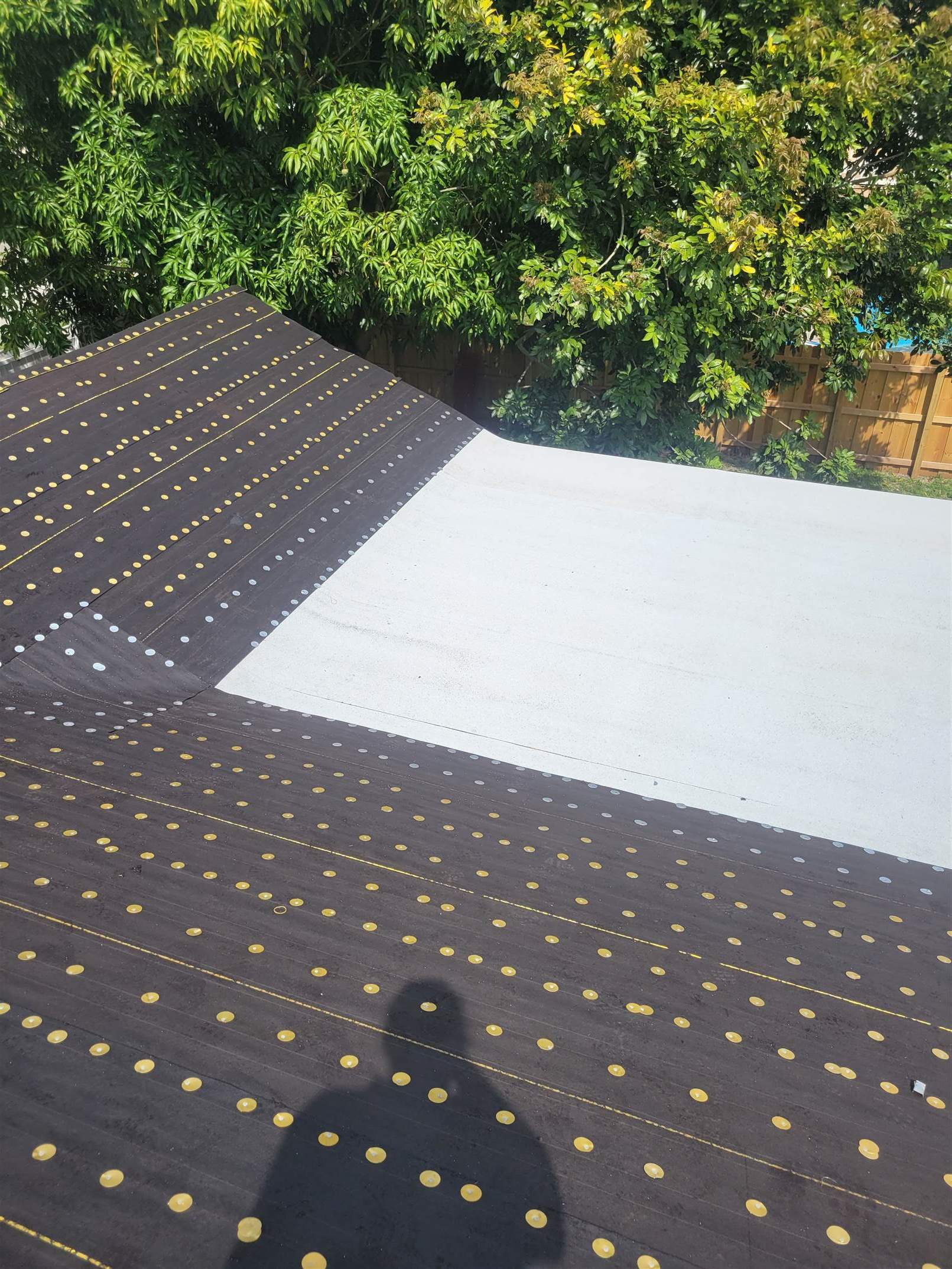 Standing Seam Metal & Flat Re-Roof using 1.5" Nail Strip 24ga Solar White Kynar Coated Standing Seam Metal Panels by Morton Roofing, Inc.